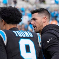 Dec 21, 2025; Charlotte, North Carolina, USA; Carolina Panthers head coach Dave Canales greets quarterback Bryce Young (9) after a win against the Tampa Bay Buccaneers at Bank of America Stadium.