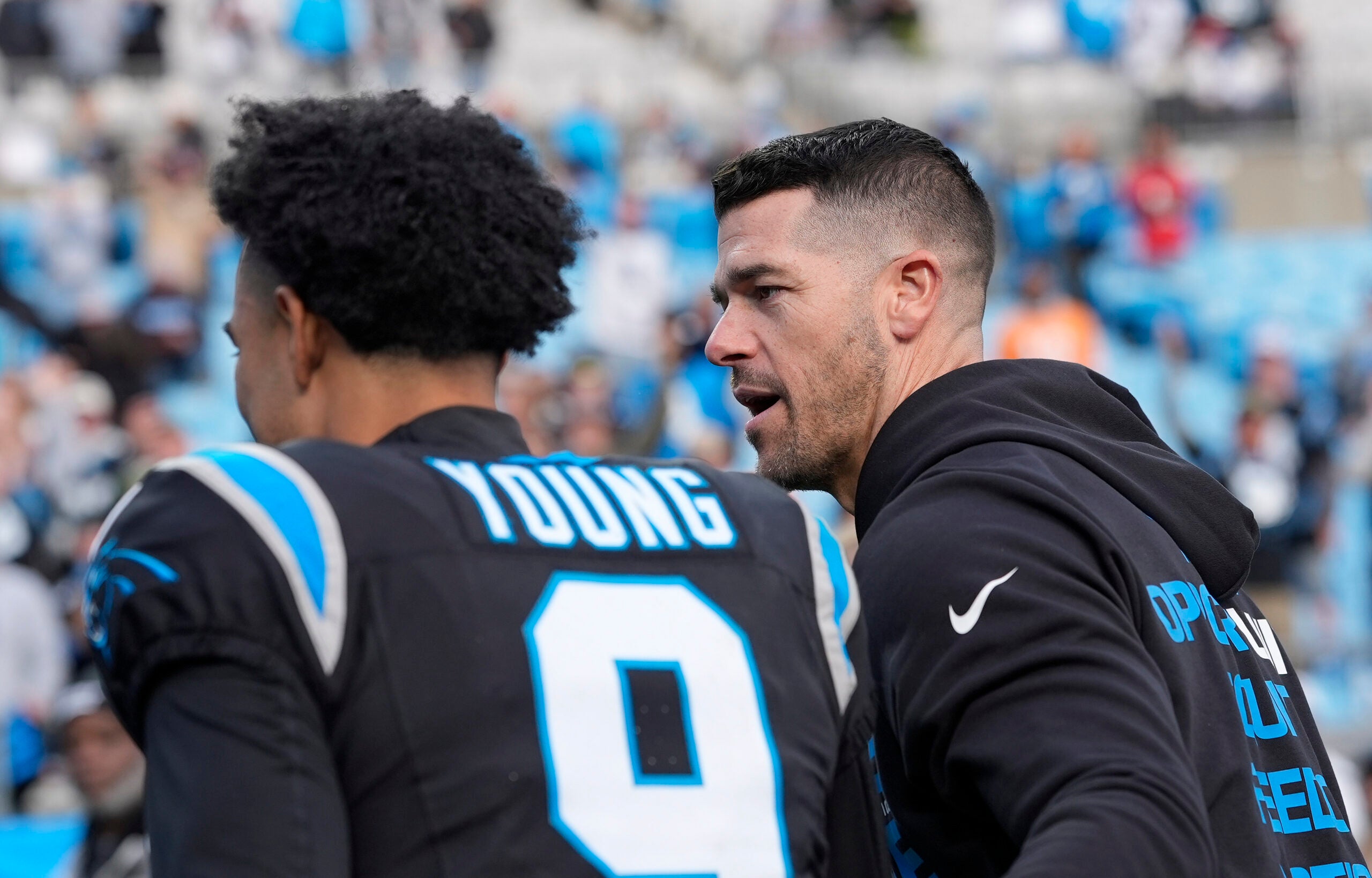 Dec 21, 2025; Charlotte, North Carolina, USA; Carolina Panthers head coach Dave Canales greets quarterback Bryce Young (9) after a win against the Tampa Bay Buccaneers at Bank of America Stadium.