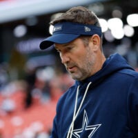 Dec 25, 2025; Landover, Maryland, USA; Dallas Cowboys head coach Brian Schottenheimer looks on during warmups before the game against the Washington Commanders at Northwest Stadium.