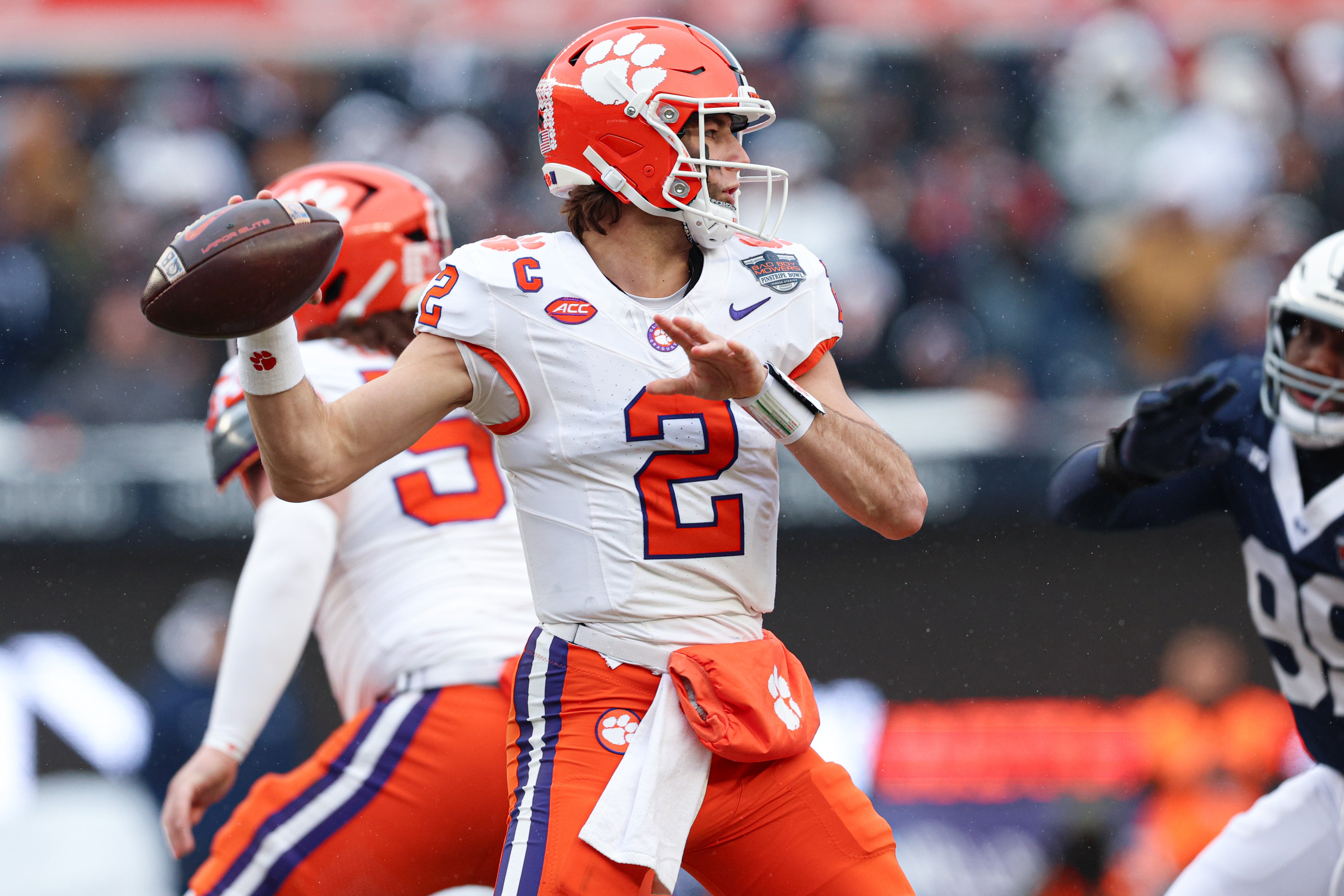 Dec 27, 2025; Bronx, NY, USA; Clemson Tigers quarterback Cade Klubnik (2) throws the ball during the first half of the 2025 Pinstripe Bowl against the Penn State Nittany Lions at Yankee Stadium.