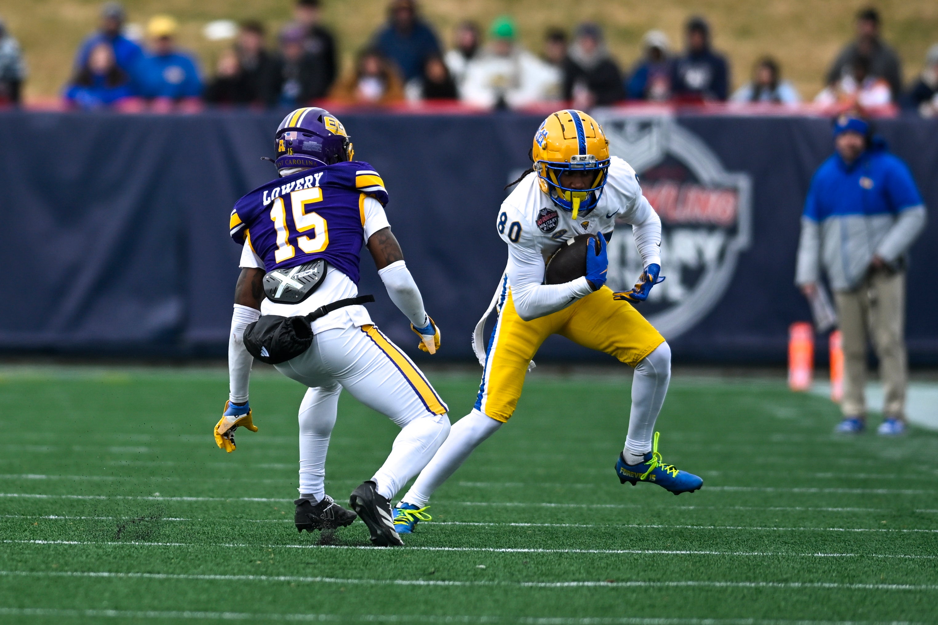 Dec 27, 2025; Annapolis, MD, USA; Pittsburgh Panthers wide receiver Bryce Yates (80) makes a move on East Carolina Pirates defensive back Jordy Lowery (15) during the second half of the Military Bowl at Navy-Marine Corps Stadium.