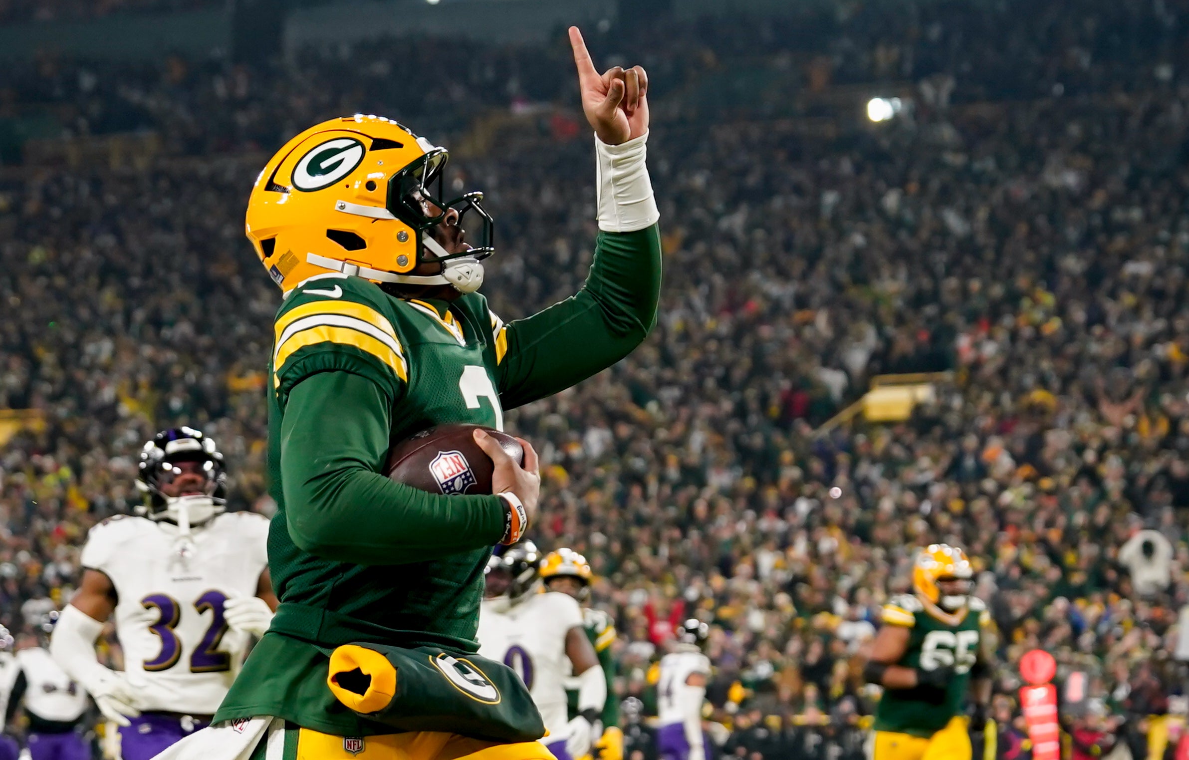 Dec 27, 2025; Green Bay, Wisconsin, USA; Green Bay Packers quarterback Malik Willis (2) celebrates after a touchdown during the second quarter against the Baltimore Ravens at Lambeau Field.