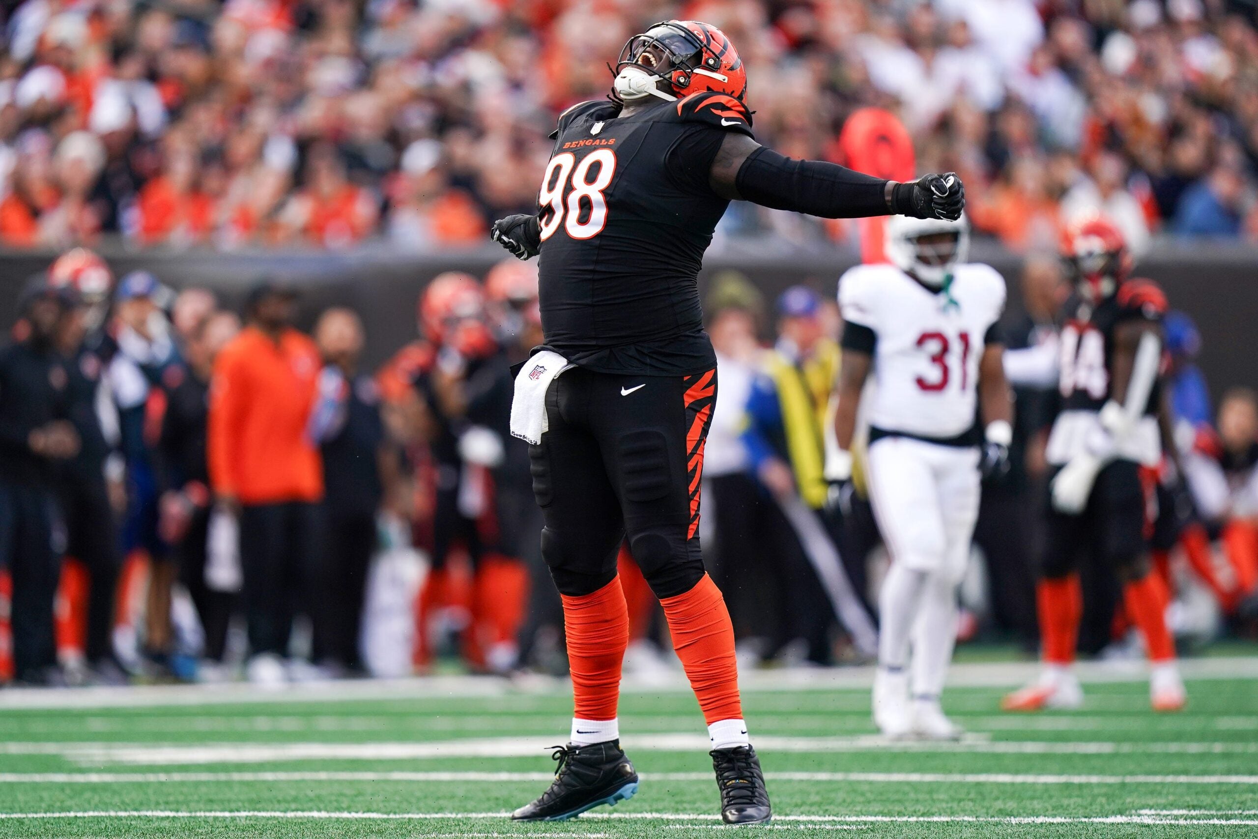 Cincinnati Bengals defensive tackle T.J. Slaton Jr. (98) reacts after a sack in the third quarter of a NFL game between the Cincinnati Bengals and Arizona Cardinals, Sunday, Dec. 28, 2025, at Paycor Stadium in downtown Cincinnati. Bengals won 37-14.
