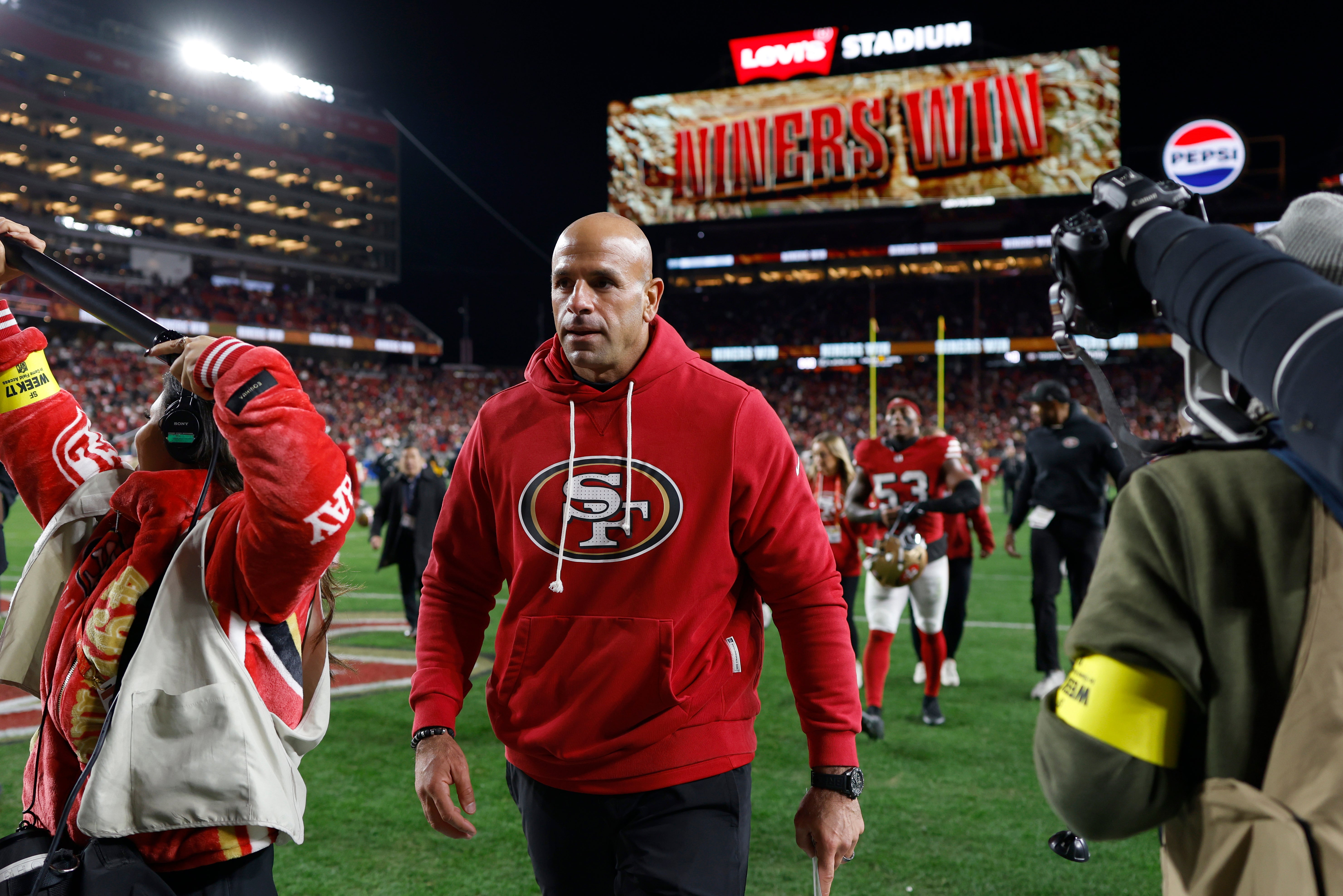 Dec 28, 2025; Santa Clara, California, USA; San Francisco 49ers defensive coordinator Robert Saleh leaves the field after defeating the Chicago Bears at Levi's Stadium.