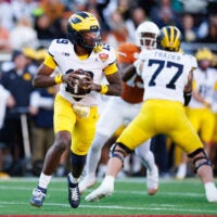 Dec 31, 2025; Orlando, FL, USA; Michigan Wolverines quarterback Bryce Underwood (19) looks to throw against the Texas Longhorns during the first half at Camping World Stadium.