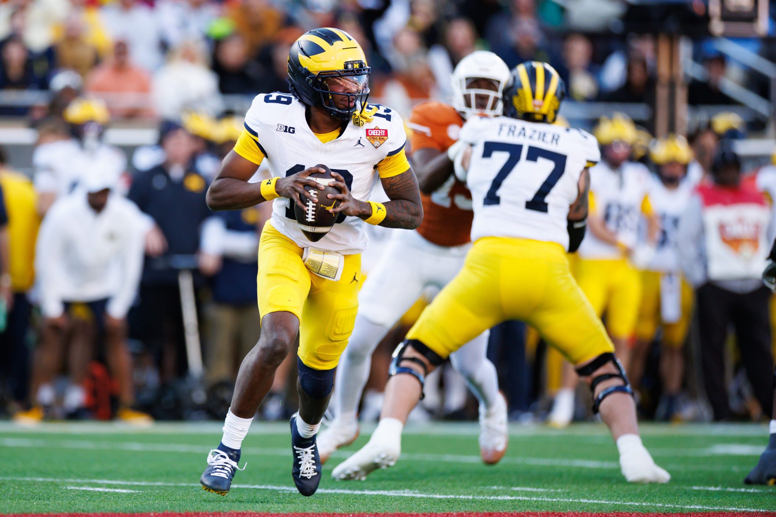 Dec 31, 2025; Orlando, FL, USA; Michigan Wolverines quarterback Bryce Underwood (19) looks to throw against the Texas Longhorns during the first half at Camping World Stadium.