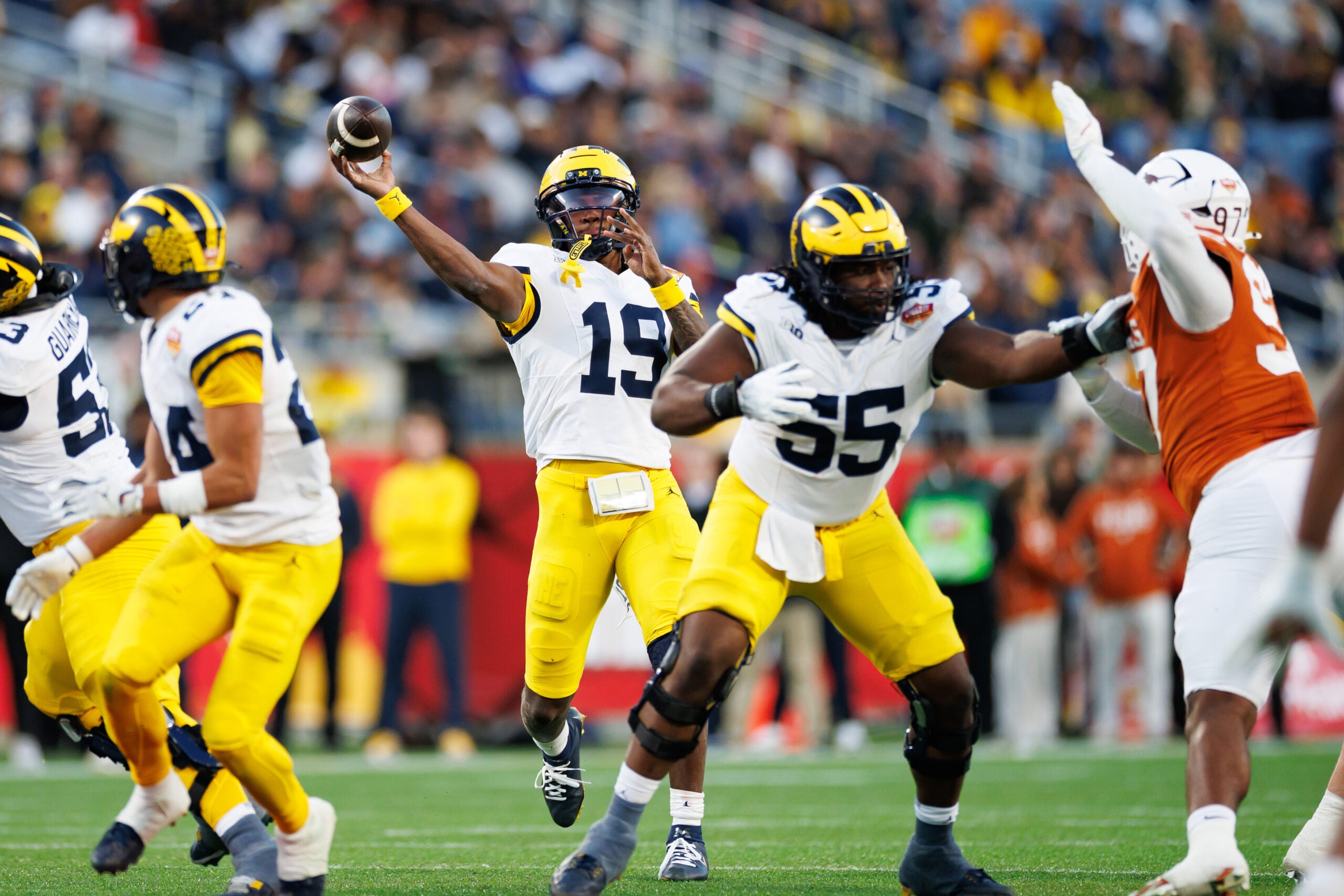 Dec 31, 2025; Orlando, FL, USA; Michigan Wolverines quarterback Bryce Underwood (19) throws the ball against the Texas Longhorns during the second half at Camping World Stadium.
