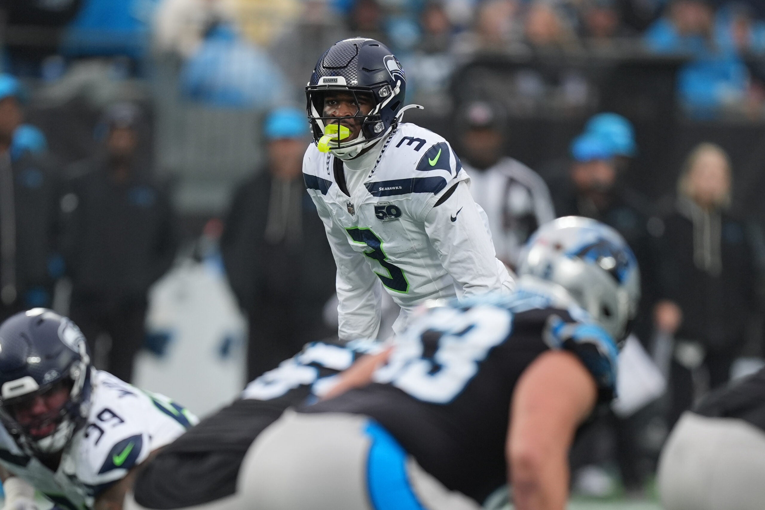 Dec 28, 2025; Charlotte, North Carolina, USA; Seattle Seahawks safety Nick Emmanwori (3) looks over the Panthers offense during the second half at Bank of America Stadium.