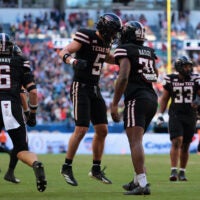 Jan 1, 2026; Miami Gardens, FL, USA; Texas Tech Red Raiders defensive back Cole Wisniewski (5) and linebacker David Bailey (31) react after a defensive play against the Oregon Ducks during the first half of the 2025 Orange Bowl and quarterfinal game of the College Football Playoff at Hard Rock Stadium.