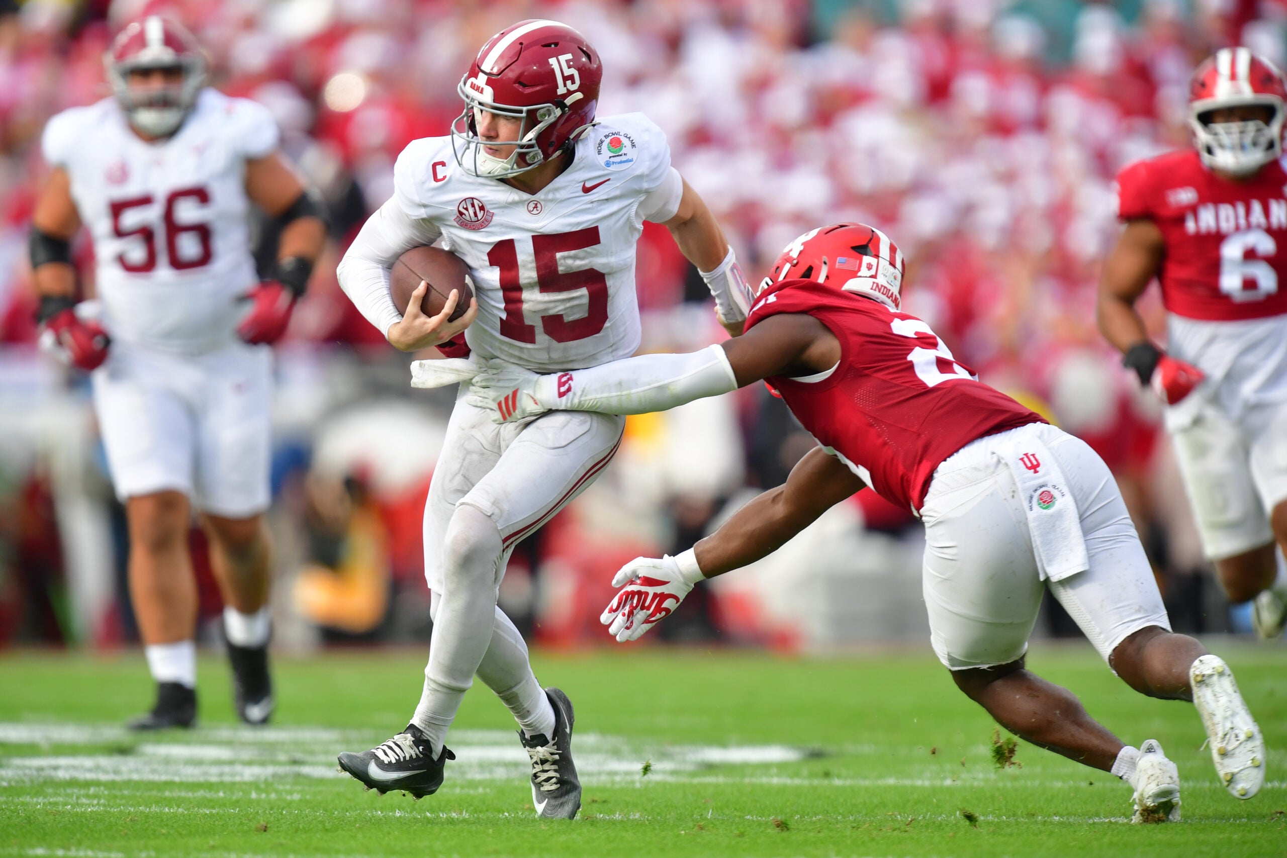 Jan 1, 2026; Pasadena, CA, USA; Alabama Crimson Tide quarterback Ty Simpson (15) runs against Indiana Hoosiers linebacker Rolijah Hardy (21) in the first half of the 2026 Rose Bowl and quarterfinal game of the College Football Playoff at Rose Bowl Stadium.