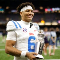 Ole Miss QB Trinidad Chambliss holds the Sugar bowl MVP trophy