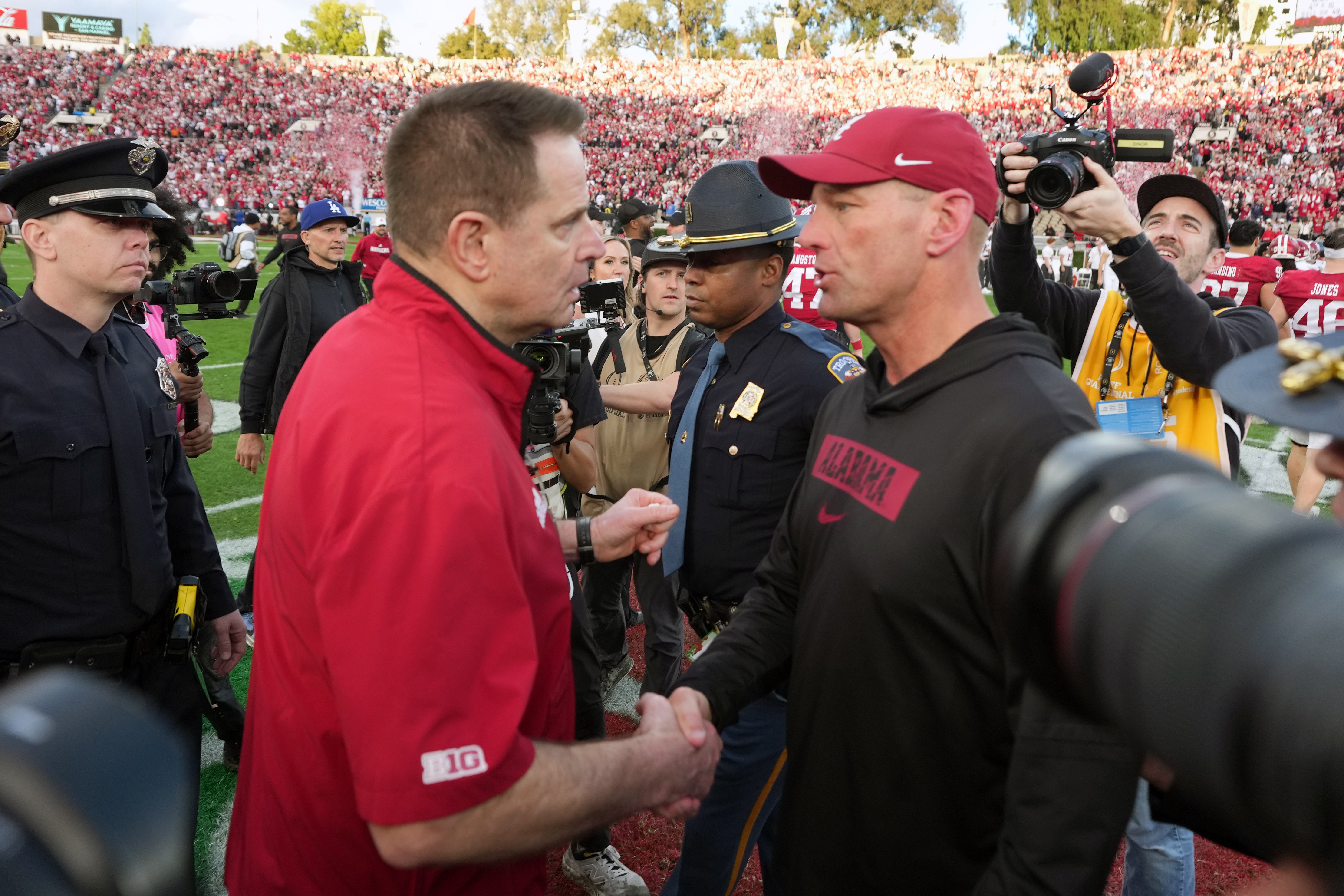 Jan 1, 2026; Pasadena, CA, USA; Indiana Hoosiers head coach Curt Cignetti (left) shakes hands with Alabama Crimson Tide head coach Kalen Deboer after the 2026 Rose Bowl and quarterfinal game of the College Football Playoff at Rose Bowl Stadium.