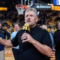 Michigan football head coach Kyle Whittingham speaks as he is being introduced on the floor during the first half between Michigan and USC at Crisler Center in Ann Arbor on Friday, Jan. 2, 2026.