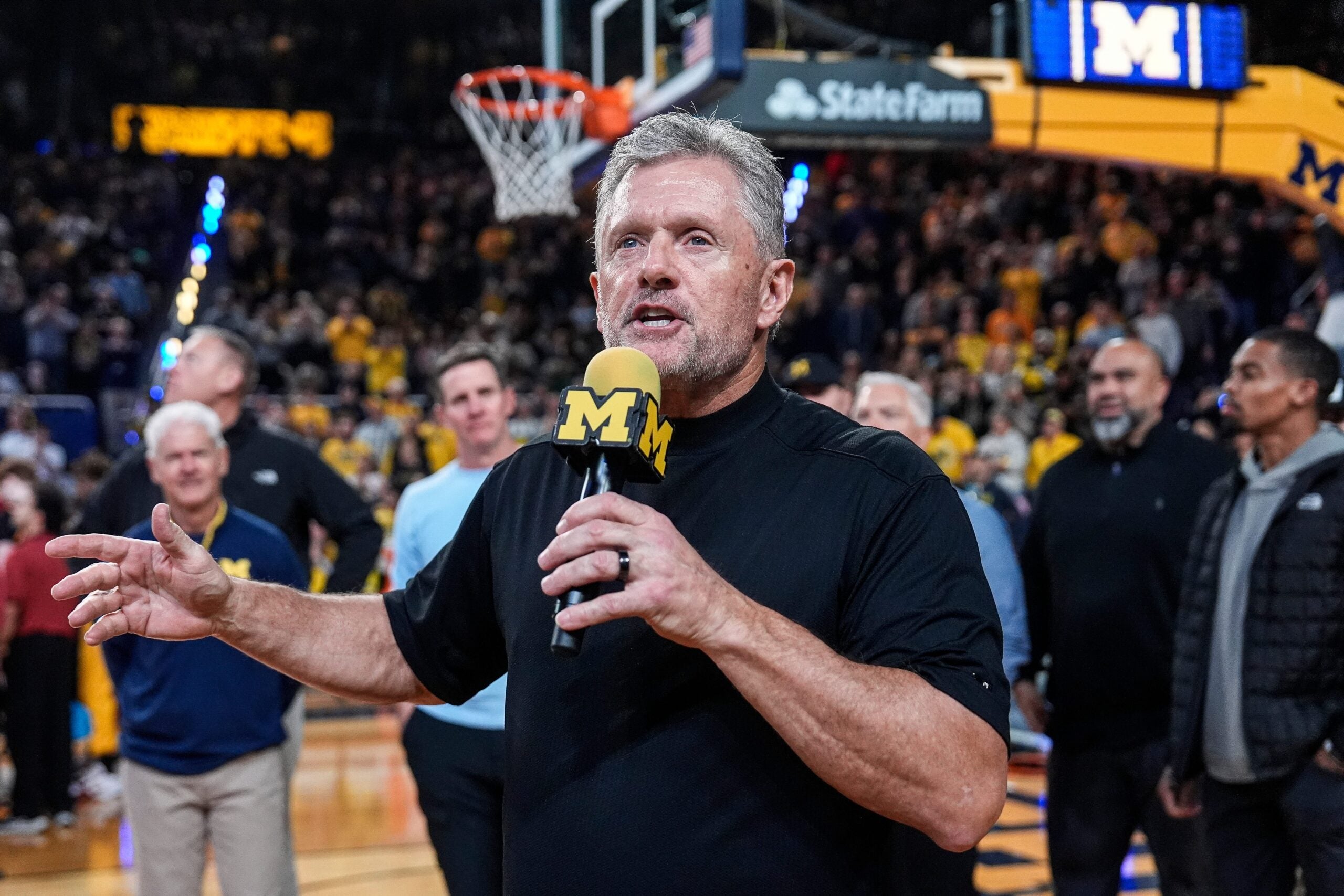 Michigan football head coach Kyle Whittingham speaks as he is being introduced on the floor during the first half between Michigan and USC at Crisler Center in Ann Arbor on Friday, Jan. 2, 2026.
