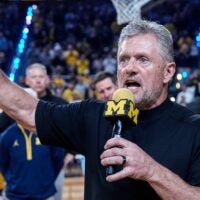 Michigan football head coach Kyle Whittingham speaks as he is being introduced on the floor during the first half between Michigan and USC at Crisler Center in Ann Arbor on Friday, Jan. 2, 2026.