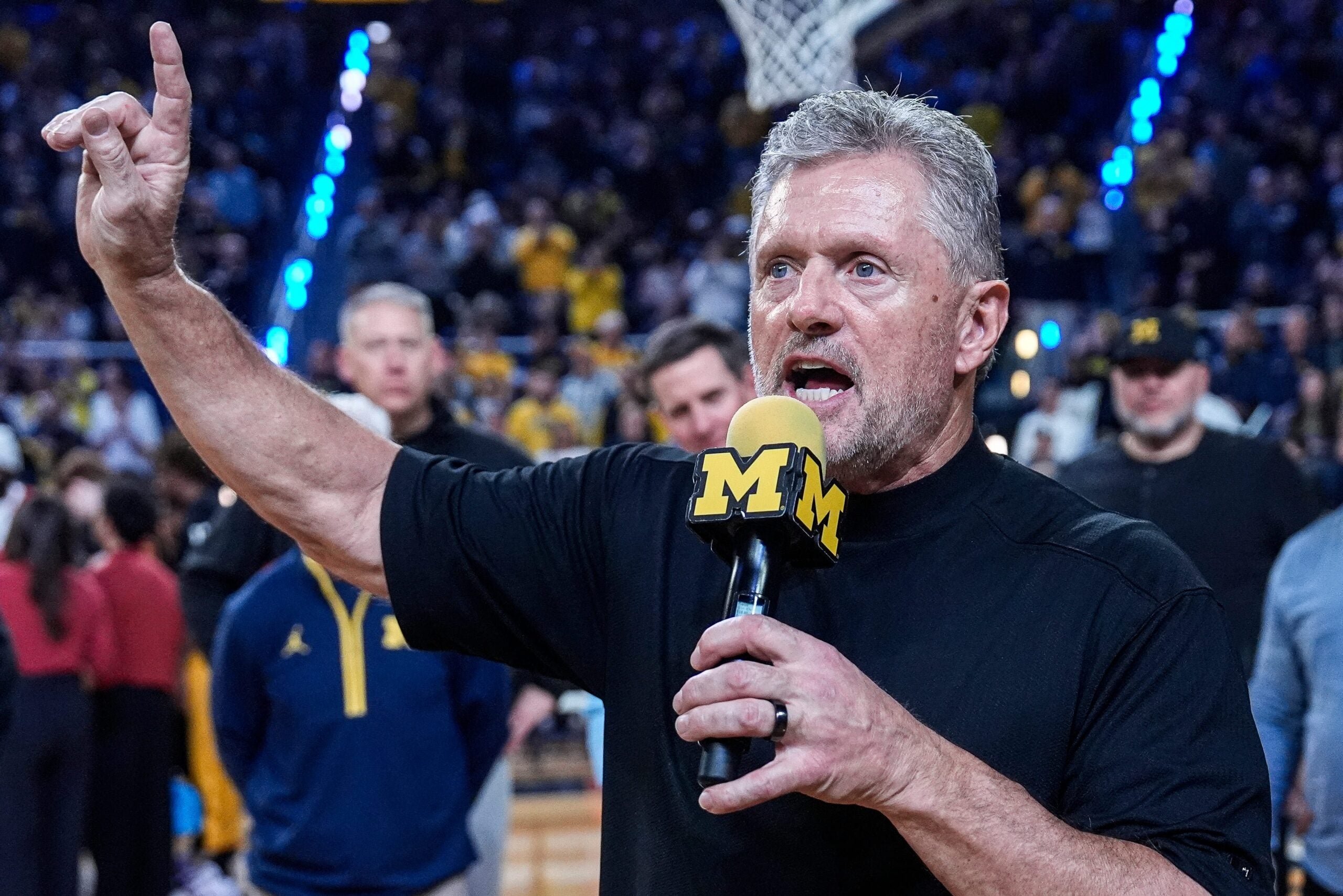 Michigan football head coach Kyle Whittingham speaks as he is being introduced on the floor during the first half between Michigan and USC at Crisler Center in Ann Arbor on Friday, Jan. 2, 2026.