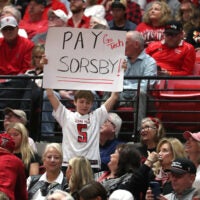 Jan 3, 2026; Lubbock, Texas, USA; A young Texas Tech Red Raiders fan shows his support for quarterback Brendan Sorsby in the second half of the basketball game against the Oklahoma State Cowboys at United Supermarkets Arena. Sorsby is currently in the NCAA football transfer portal. Mandatory Credit: Michael C. Johnson-Imagn Images