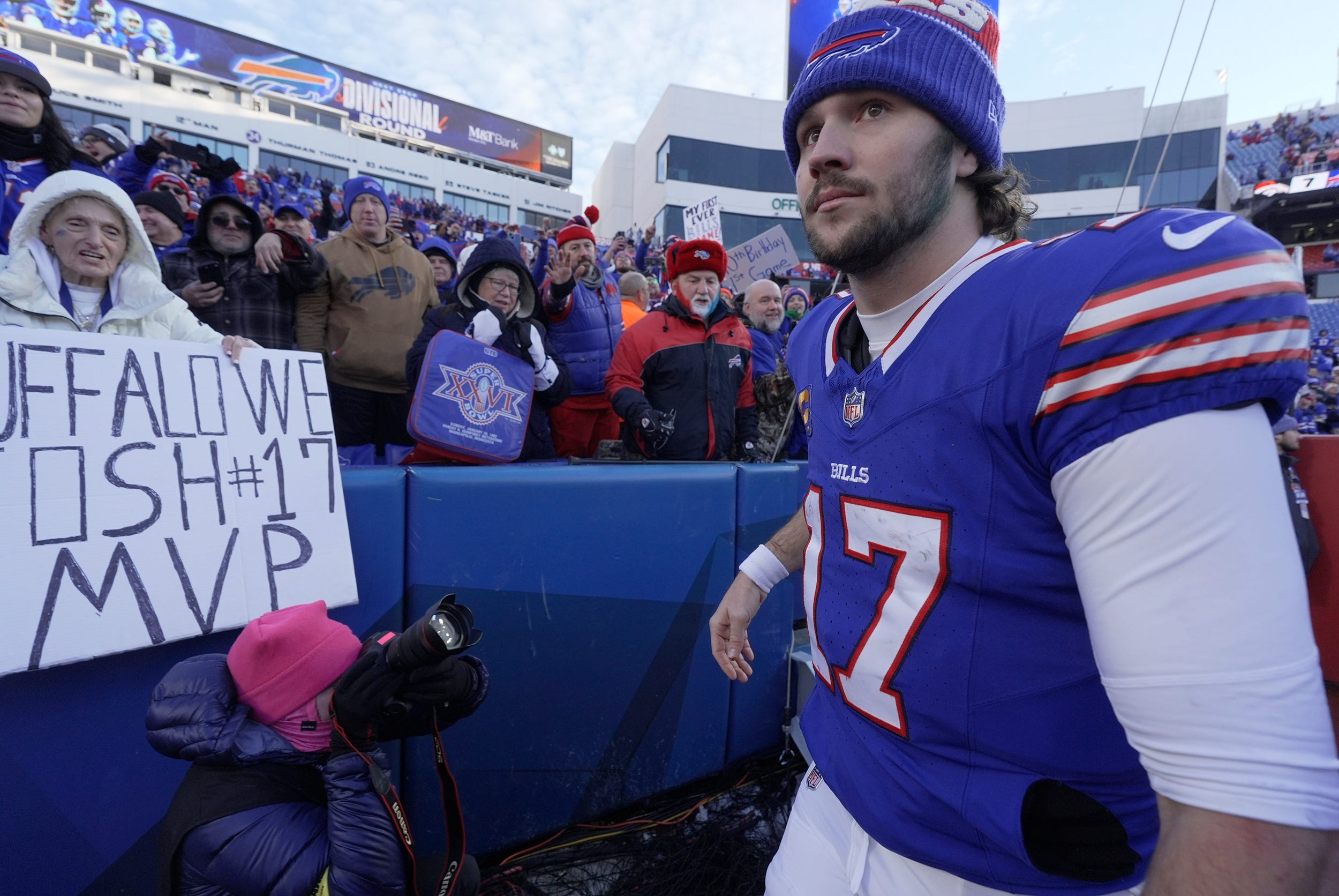 Buffalo Bills quarterback Josh Allen (17) briefly interacts with fans before leaving the field after the Bills victory against the Denver Broncos at Highmark Stadium in Orchard Park on Jan. 12, 2025.