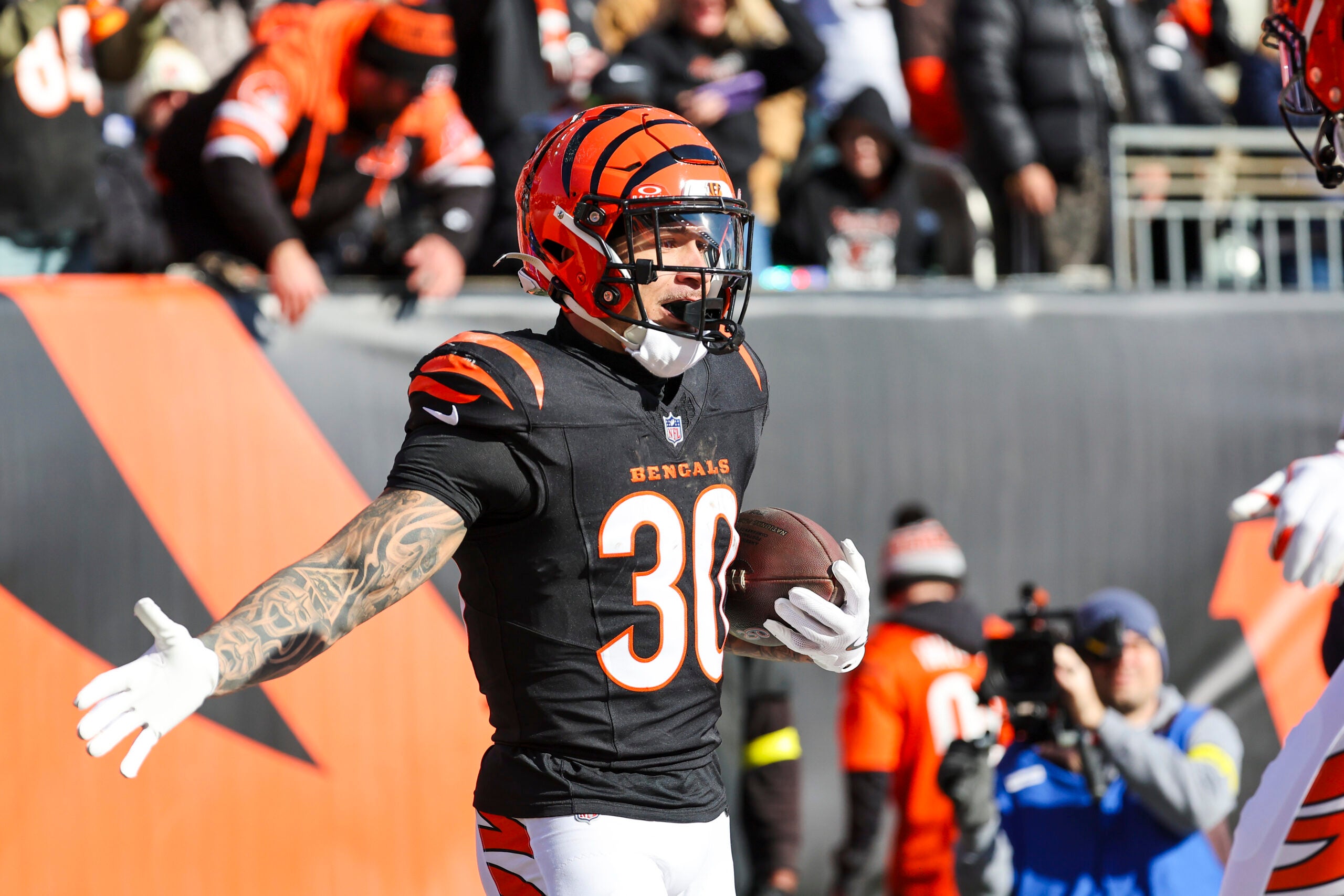 Jan 4, 2026; Cincinnati, Ohio, USA; Cincinnati Bengals running back Chase Brown (30) celebrates after catching a touchdown pass against the Cleveland Browns during the first quarter at Paycor Stadium.
