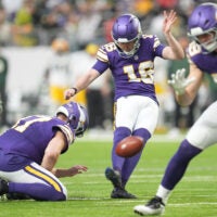 Jan 4, 2026; Minneapolis, Minnesota, USA; Minnesota Vikings place kicker Will Reichard (16) kicks the ball against the Green Bay Packers during the second quarter at U.S. Bank Stadium.