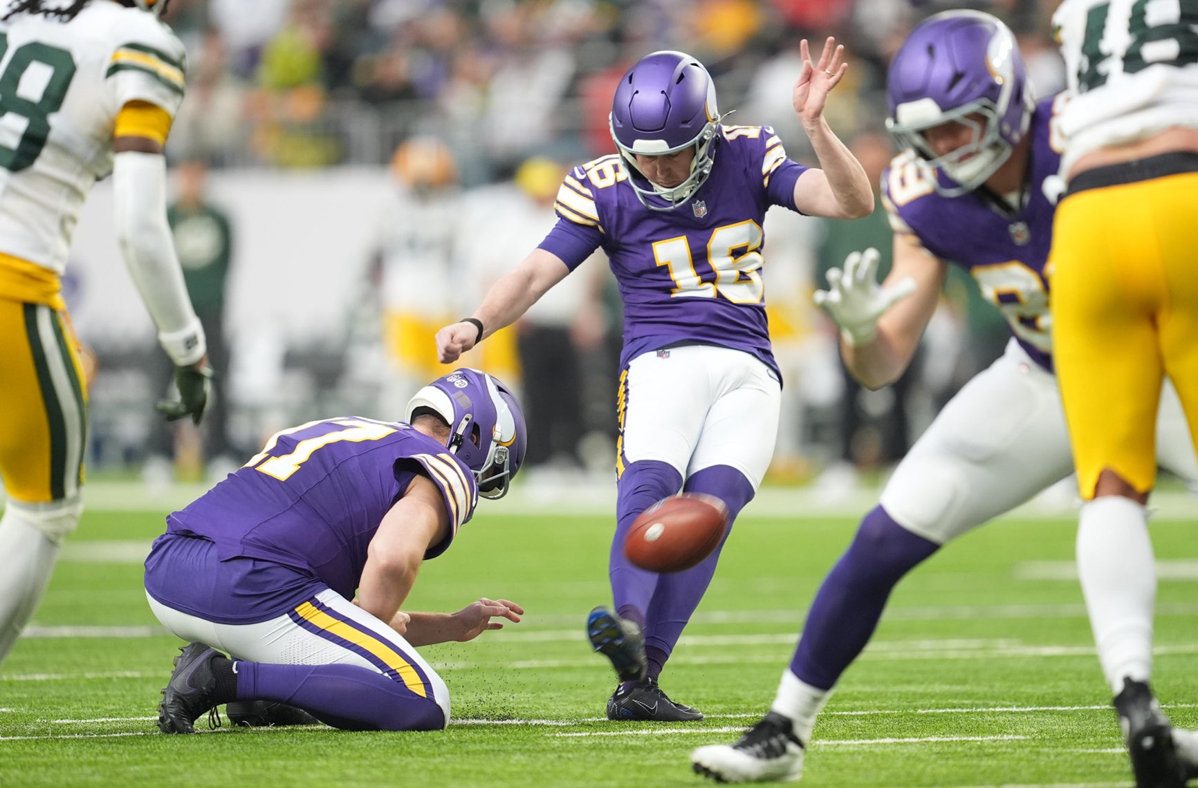Jan 4, 2026; Minneapolis, Minnesota, USA; Minnesota Vikings place kicker Will Reichard (16) kicks the ball against the Green Bay Packers during the second quarter at U.S. Bank Stadium.