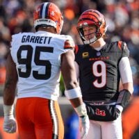 Cincinnati Bengals quarterback Joe Burrow (9) and Cleveland Browns defensive end Myles Garrett (95) talk between plays in the first quarter of the NFL Week 18 game between the Cincinnati Bengals and the Cleveland Browns at Paycor Stadium in Downtown Cincinnati on Sunday, Jan. 4, 2026.