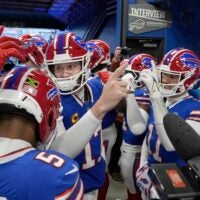 Bills quarterback Josh Allen huddles up the offense in the players tunnel before taking the field for their last regular season game against the New York Jets at Highmark Stadium in Orchard Park Sunday, Jan. 4, 2026