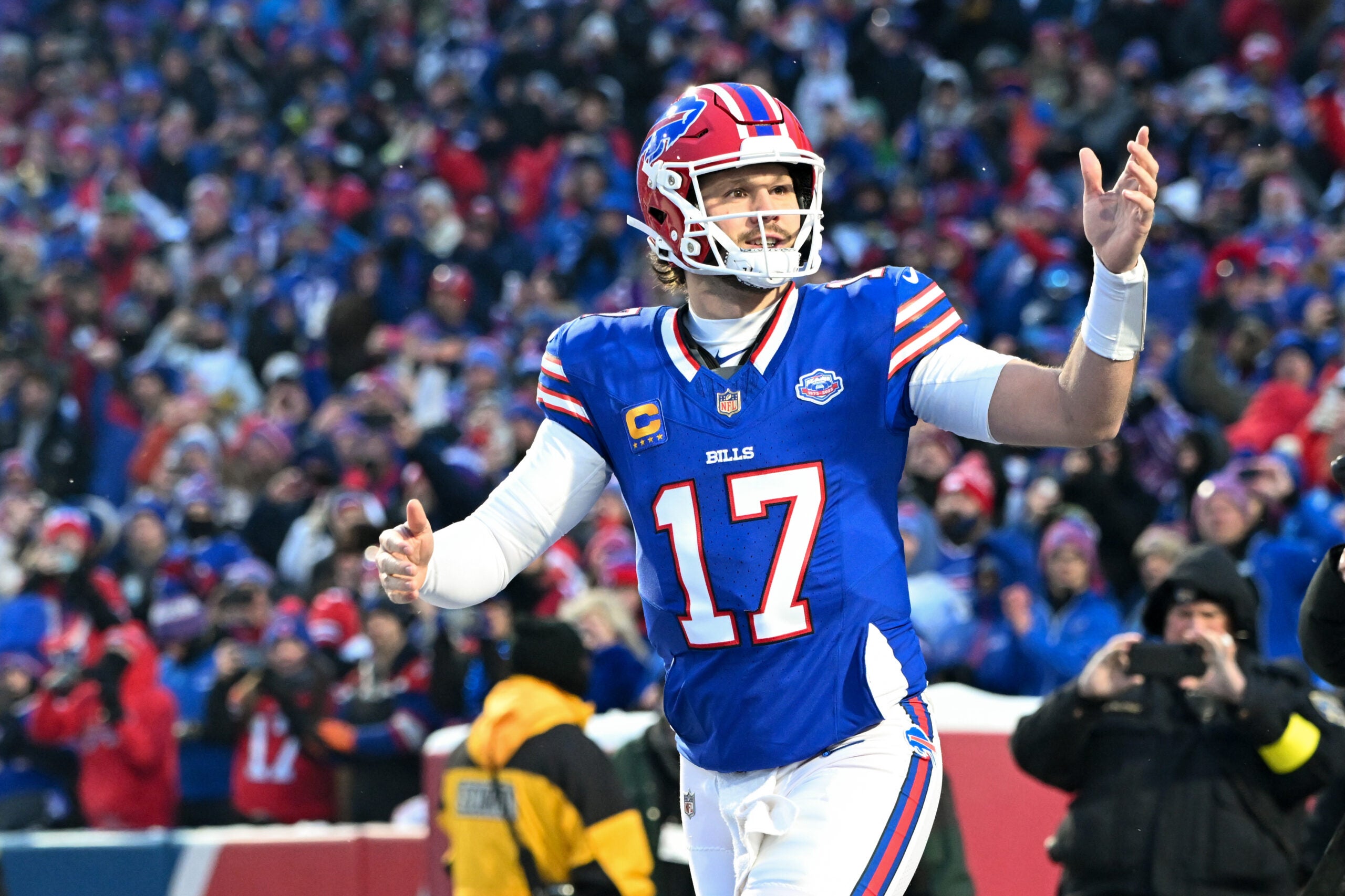 Jan 4, 2026; Orchard Park, New York, USA; Buffalo Bills quarterback Josh Allen (17) runs onto the field before the game against the New York Jets at Highmark Stadium.