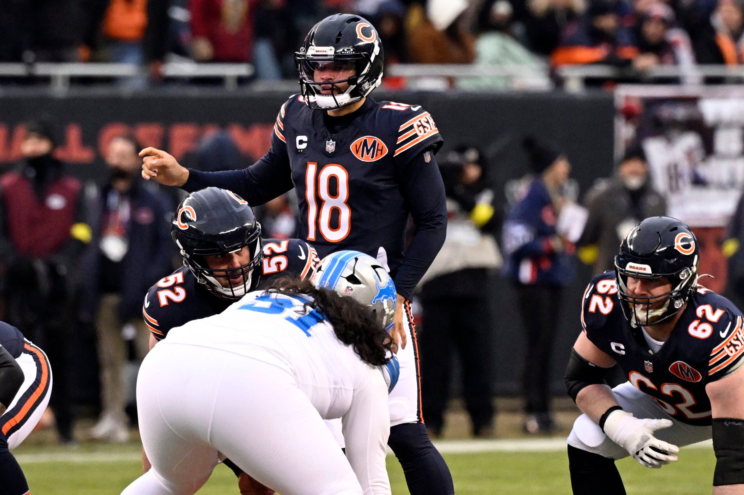 Jan 4, 2026; Chicago, Illinois, USA; Chicago Bears quarterback Caleb Williams (18) gestures before the snap against the Detroit Lions during the first half at Soldier Field.