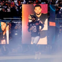 Jan 4, 2026; Chicago, Illinois, USA; Chicago Bears quarterback Caleb Williams (18) runs onto the field before the game between the Chicago Bears and the Detroit Lions at Soldier Field.