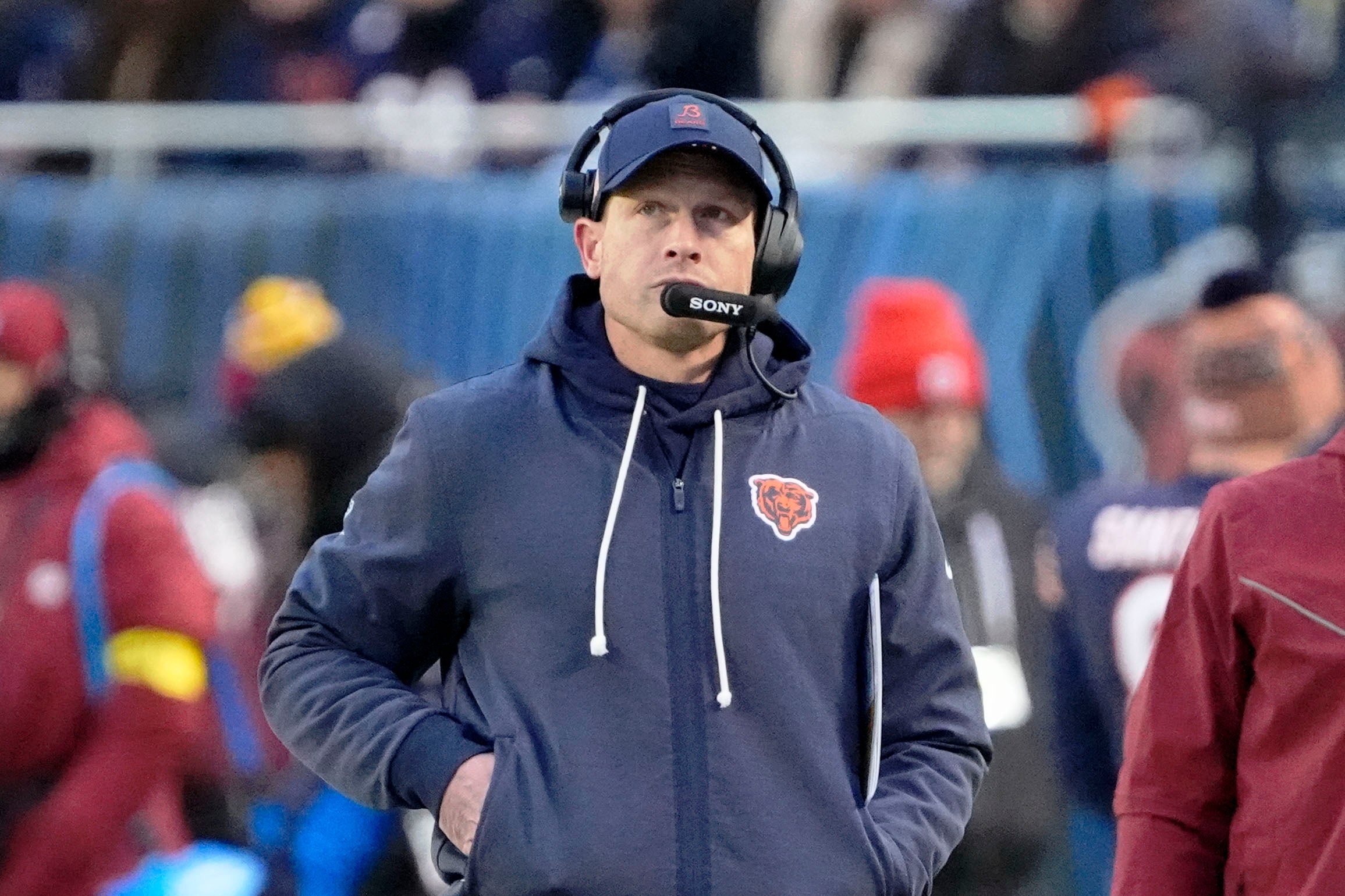 Jan 4, 2026; Chicago, Illinois, USA; Chicago Bears head coach Ben Johnson looks on from the sideline against the Detroit Lions during the first half at Soldier Field.