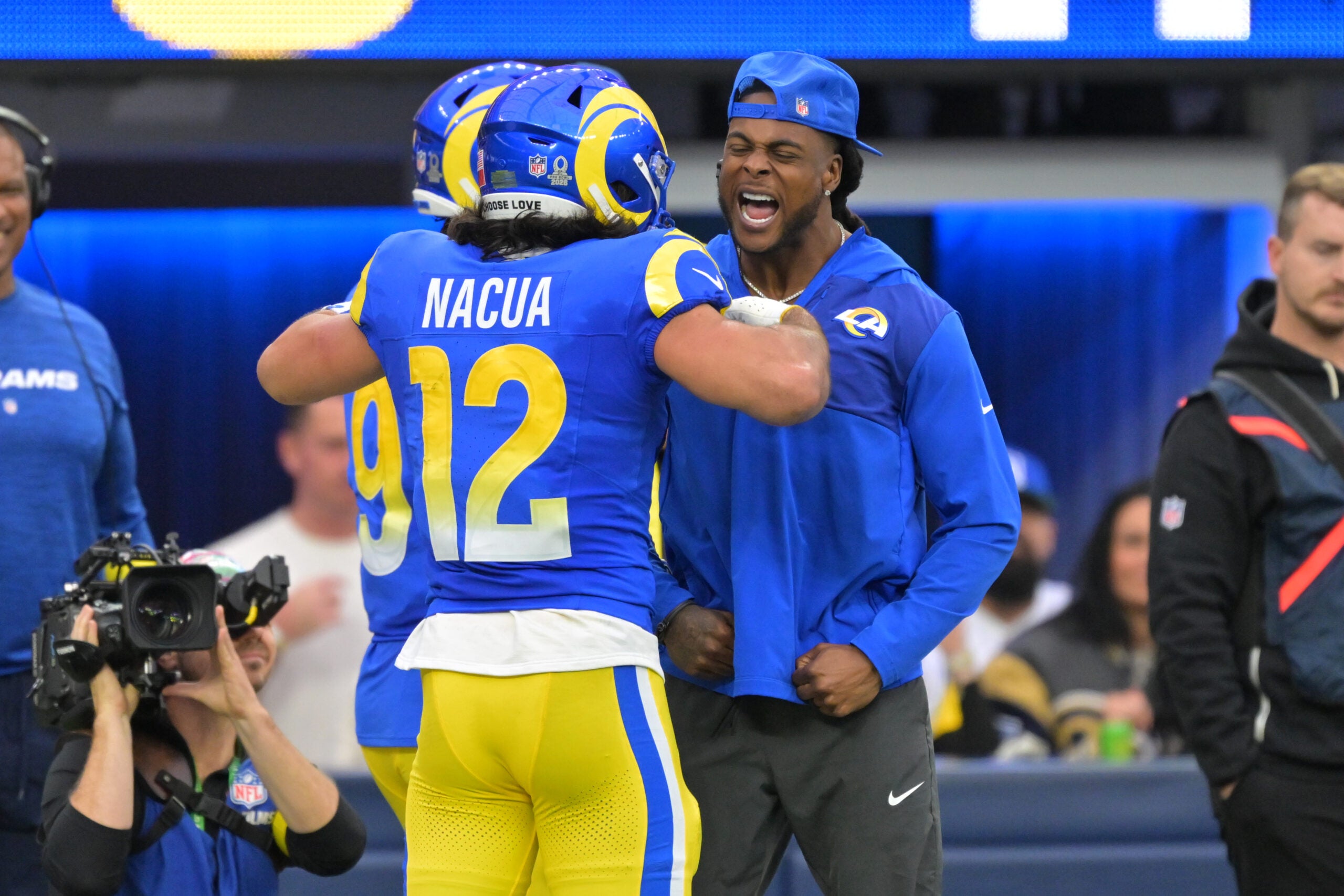 Jan 4, 2026; Inglewood, California, USA; Los Angeles Rams wide receiver Puka Nacua (12) reacts after scoring a touchdown with wide receiver Davante Adams during the first half against the Arizona Cardinals at SoFi Stadium.
