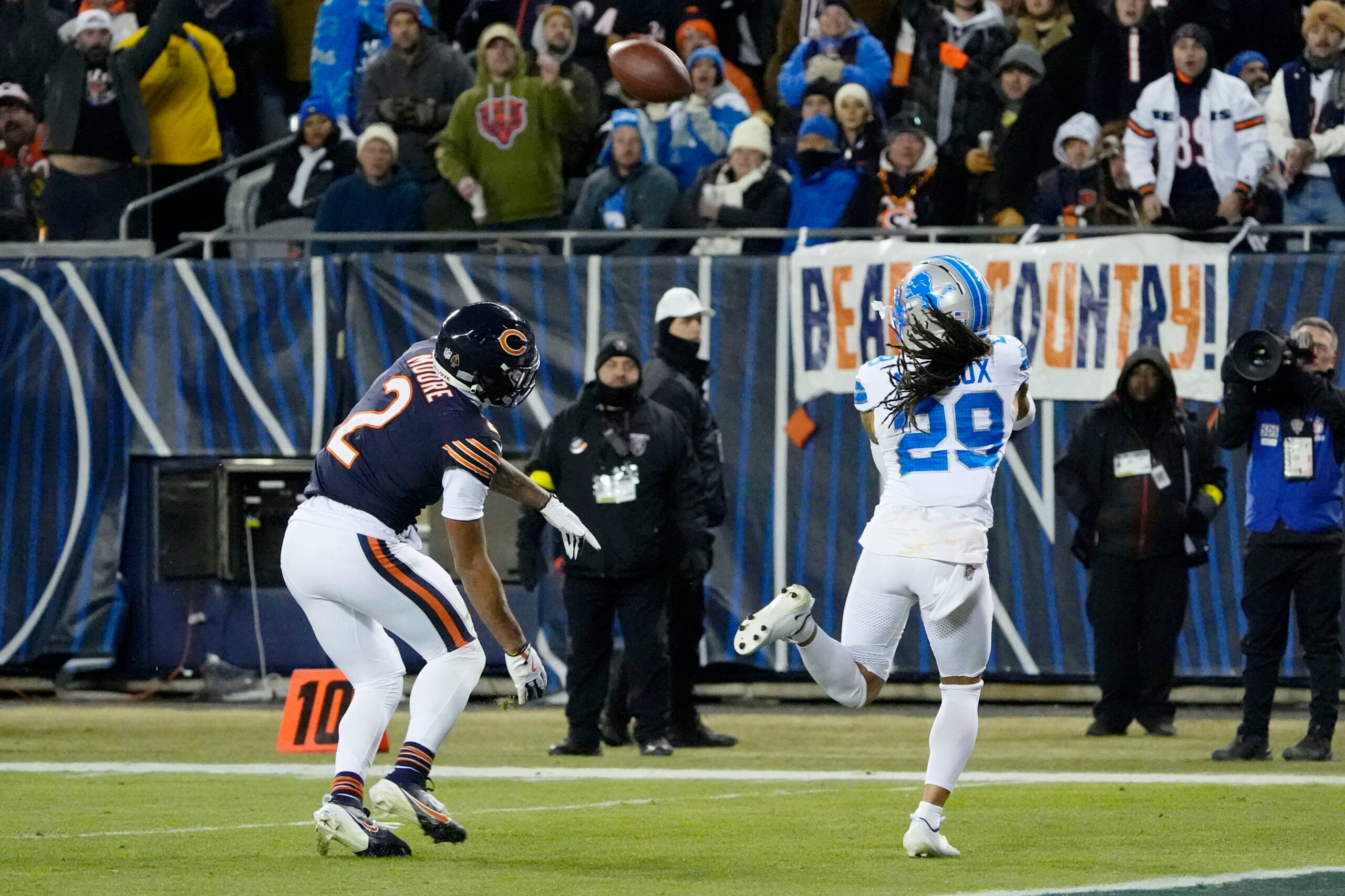 Jan 4, 2026; Chicago, Illinois, USA; Detroit Lions cornerback Avonte Maddox (29) intercepts a pass intended for Chicago Bears wide receiver DJ Moore (2) during the second half at Soldier Field.