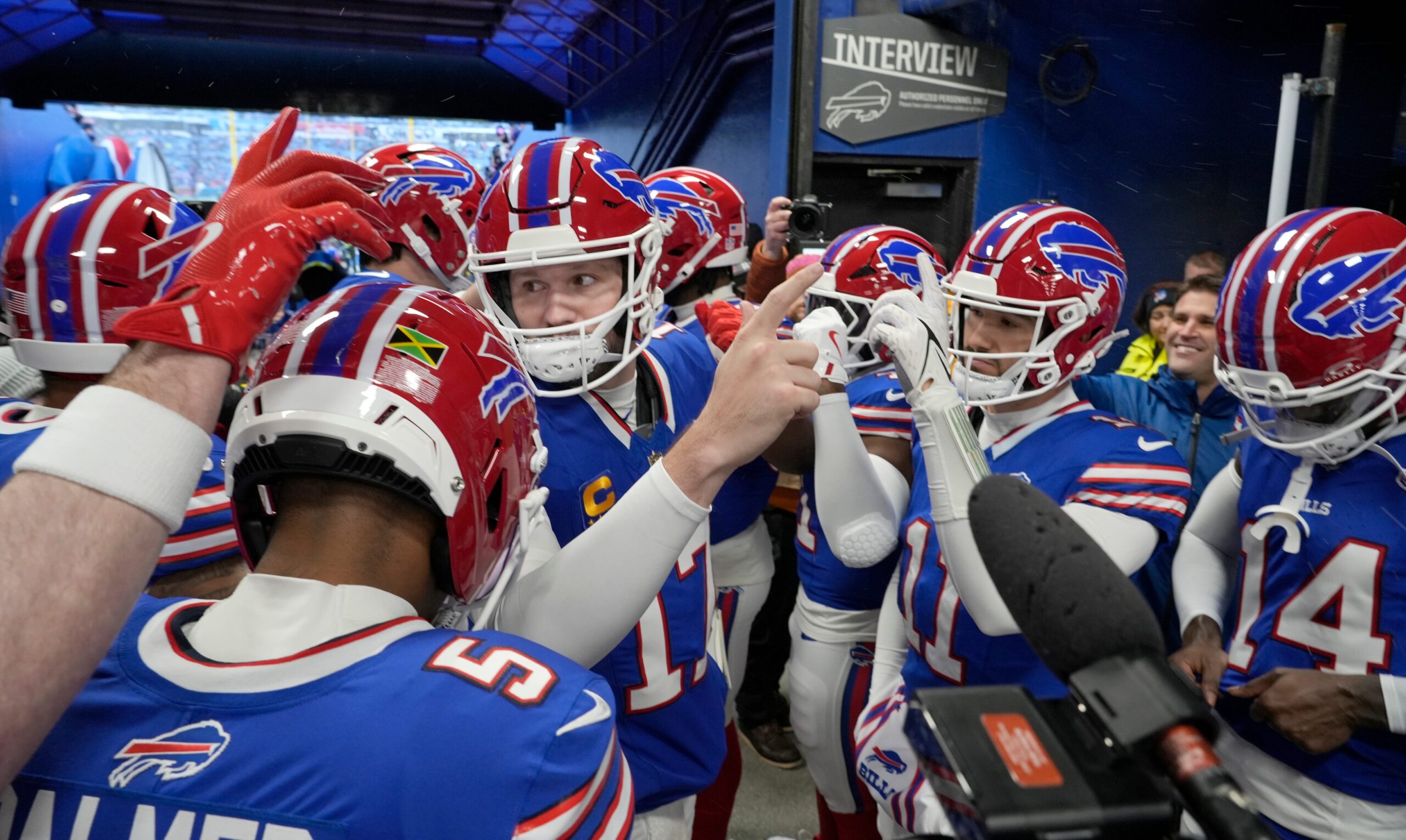 Bills quarterback Josh Allen huddles up the offense in the players tunnel before taking the field for their last regular season game against the New York Jets at Highmark Stadium in Orchard Park Sunday, Jan. 4, 2026