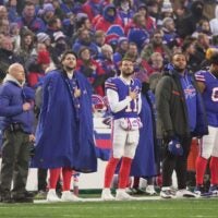 Buffalo Bills head coach Sean McDermott, quarterback Josh Allen, quarterback Mitchell Trubisky, and left tackle Dion Dawkins listen to the singing of the National Anthem before first half action against the Jets at home in Highmark Stadium in Orchard Park on Jan. 4, 2026.