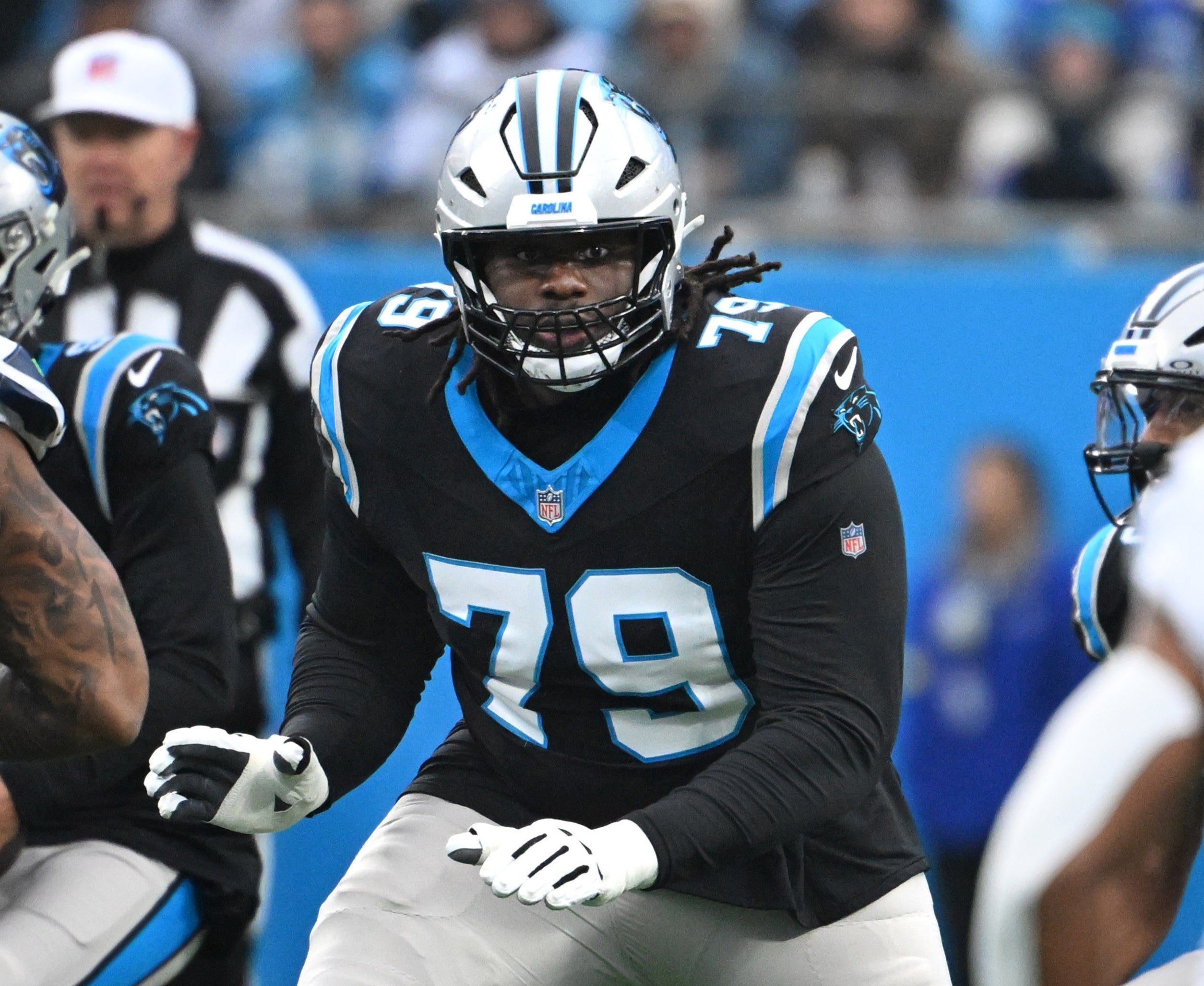 Dec 28, 2025; Charlotte, North Carolina, USA; Carolina Panthers offensive tackle Ikem Ekwonu (79) at the line of scrimmage in the first quarter at Bank of America Stadium.