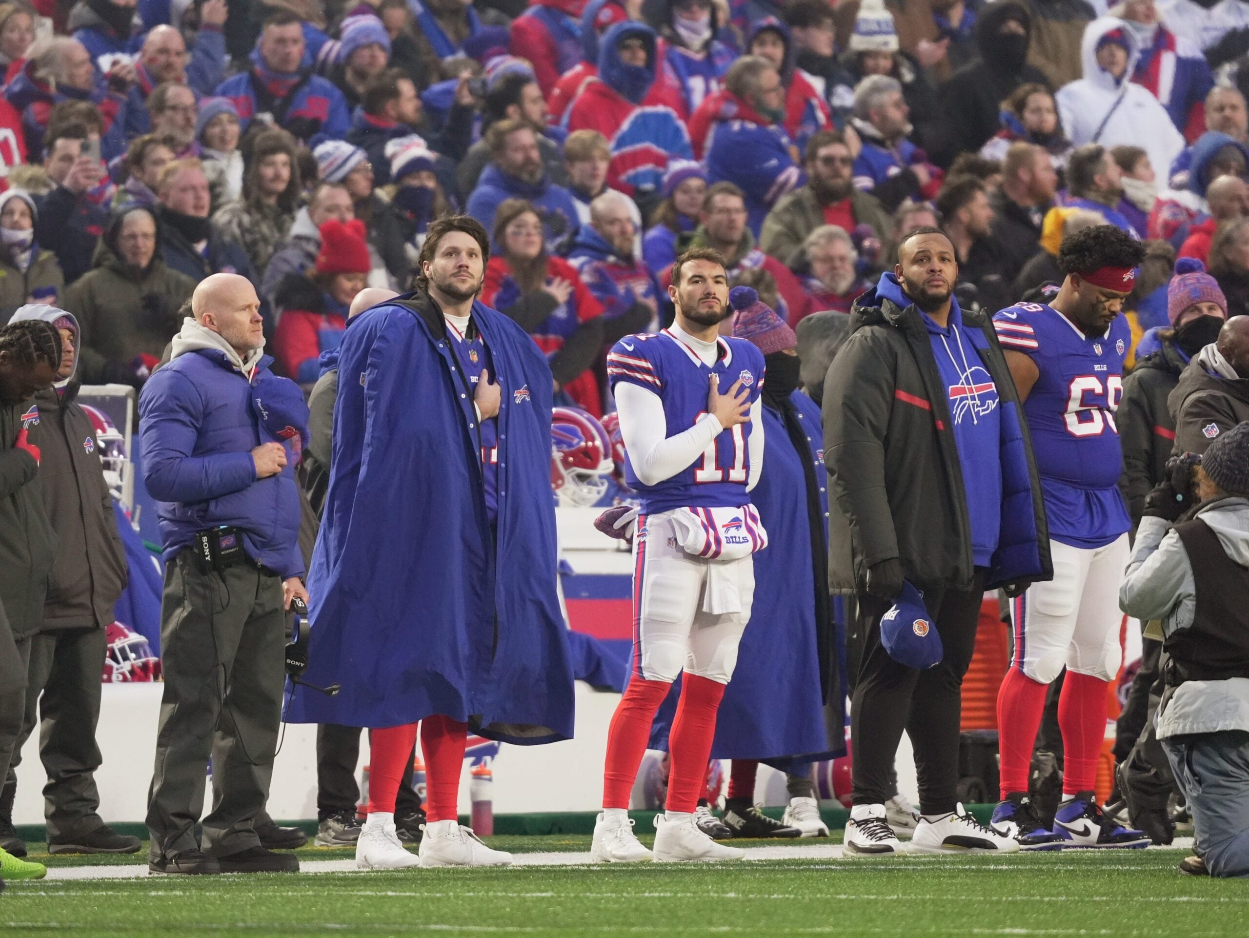 Buffalo Bills head coach Sean McDermott, quarterback Josh Allen, quarterback Mitchell Trubisky, and left tackle Dion Dawkins listen to the singing of the National Anthem before first half action against the Jets at home in Highmark Stadium in Orchard Park on Jan. 4, 2026.