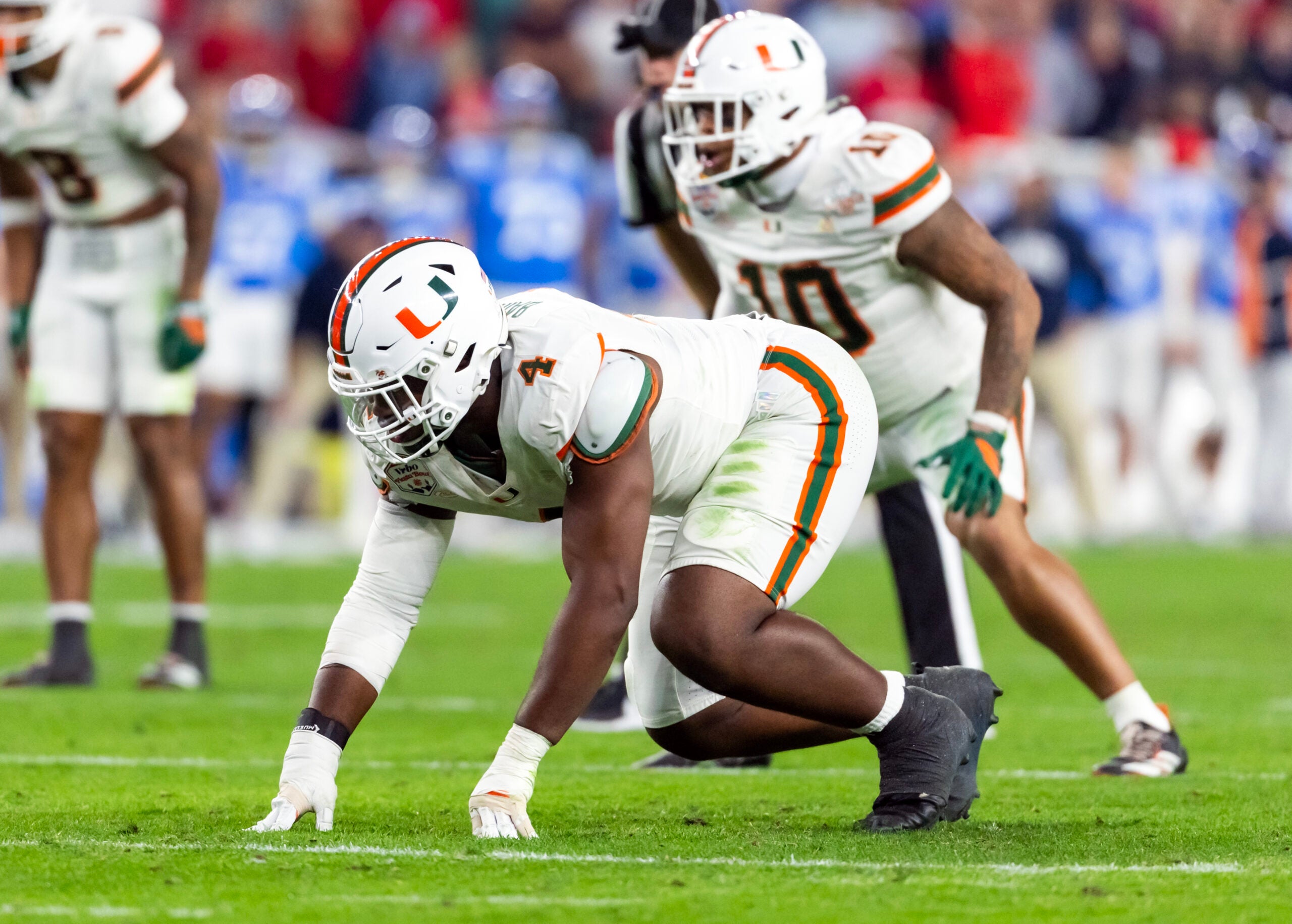Jan 8, 2026; Glendale, AZ, USA; Miami Hurricanes defensive lineman Rueben Bain Jr. (4) against the Mississippi Rebels during the 2026 Fiesta Bowl and semifinal game of the College Football Playoff at State Farm Stadium.
