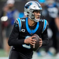 Jan 10, 2026; Charlotte, NC, USA; Carolina Panthers quarterback Bryce Young (9) drops back to pass against the Los Angeles Rams in the first half during the NFC Wild Card Round game at Bank of America Stadium.