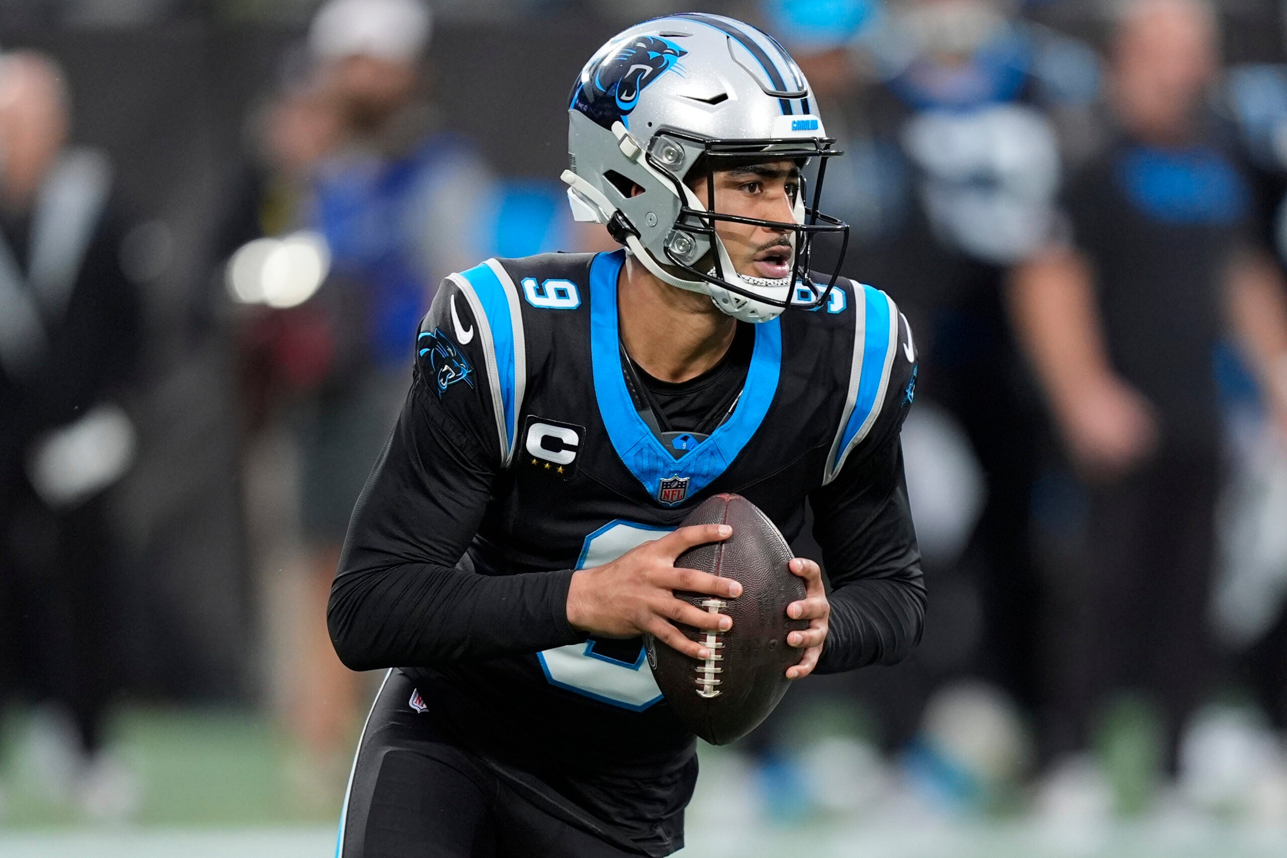 Jan 10, 2026; Charlotte, NC, USA; Carolina Panthers quarterback Bryce Young (9) drops back to pass against the Los Angeles Rams in the first half during the NFC Wild Card Round game at Bank of America Stadium.