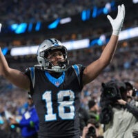 Jan 10, 2026; Charlotte, NC, USA; Carolina Panthers wide receiver Jalen Coker (18) reacts after making a touchdown against the Los Angeles Rams in the second half during the NFC Wild Card Round game at Bank of America Stadium.
