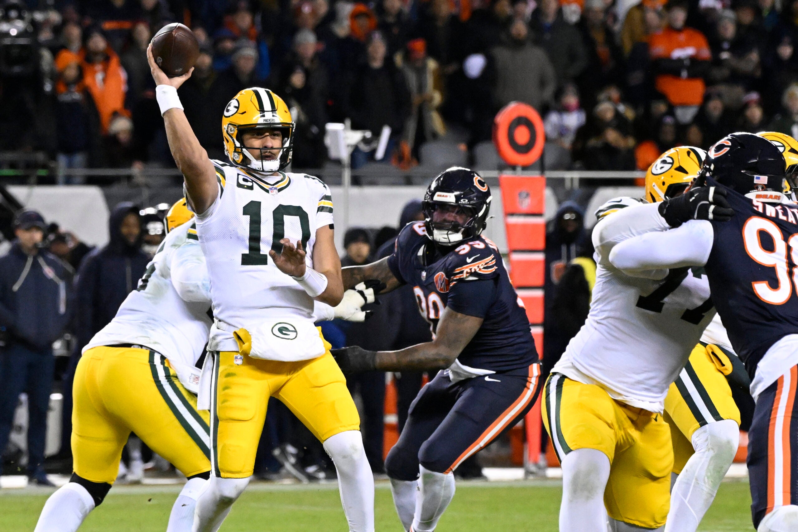 Jan 10, 2026; Chicago, IL, USA; Green Bay Packers quarterback Jordan Love (10) throws a pass against the Chicago Bears during the first half of an NFC Wild Card Round game at Soldier Field.