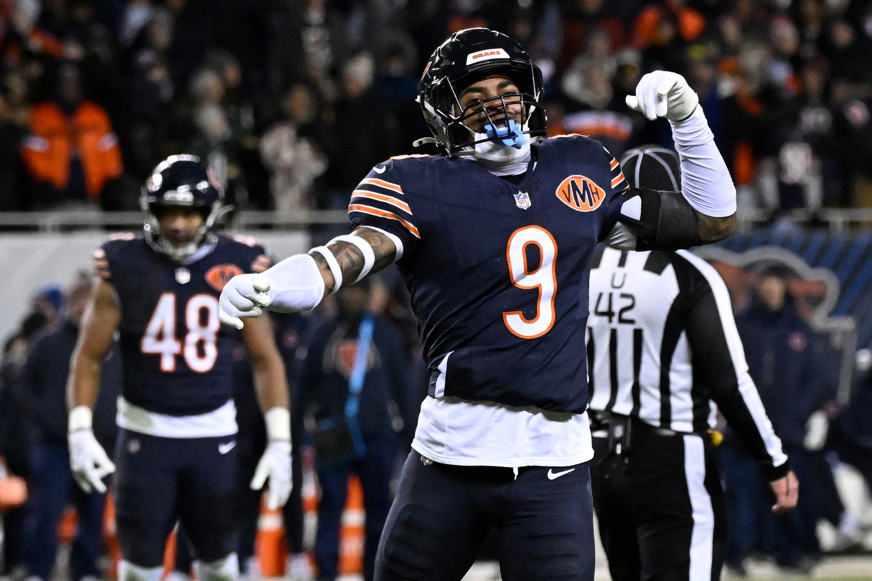Jan 10, 2026; Chicago, IL, USA; Chicago Bears safety Jaquan Brisker (9) fires up the crowd after a penalty call against the Green Bay Packers during the second half of an NFC Wild Card Round game at Soldier Field.