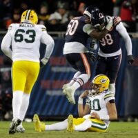 Chicago Bears defensive end Grady Jarrett (50) and defensive end Montez Sweat (98) celebrates forcing an incomplete pass by Green Bay Packers quarterback Jordan Love (10) in the fourth quarter during their wild-card playoff football game Saturday, January 10, 2026, at Soldier Field in Chicago, Illinois.