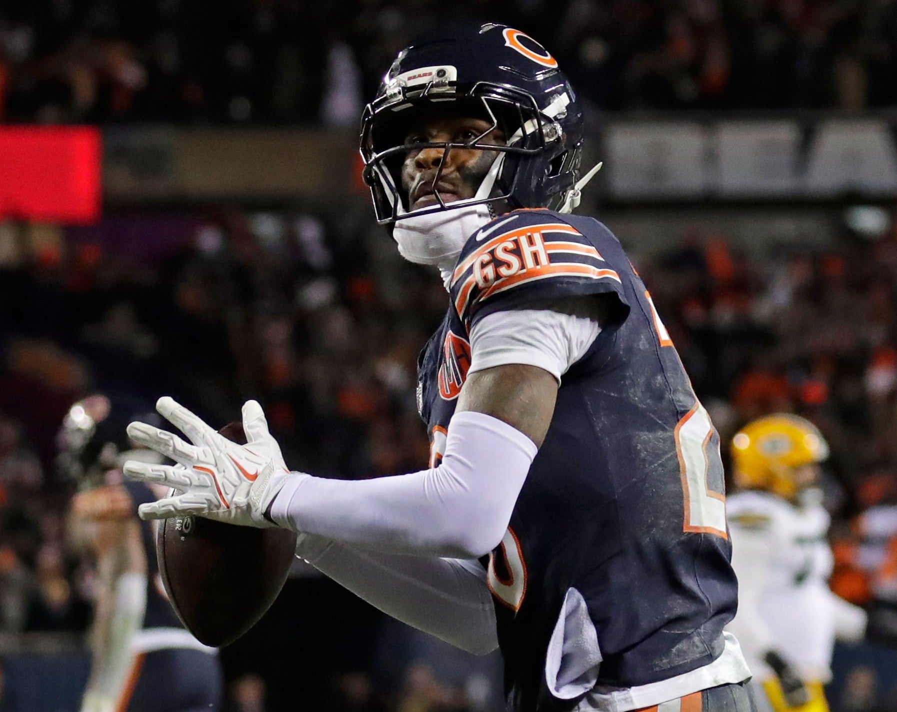 Chicago Bears cornerback Nahshon Wright (26) throws the game ball into the crowd as Green Bay Packers wide receiver Christian Watson (9) reacts to losing the game at the end of their wild-card playoff football game Saturday, January 10, 2026, at Soldier Field in Chicago, Illinois.