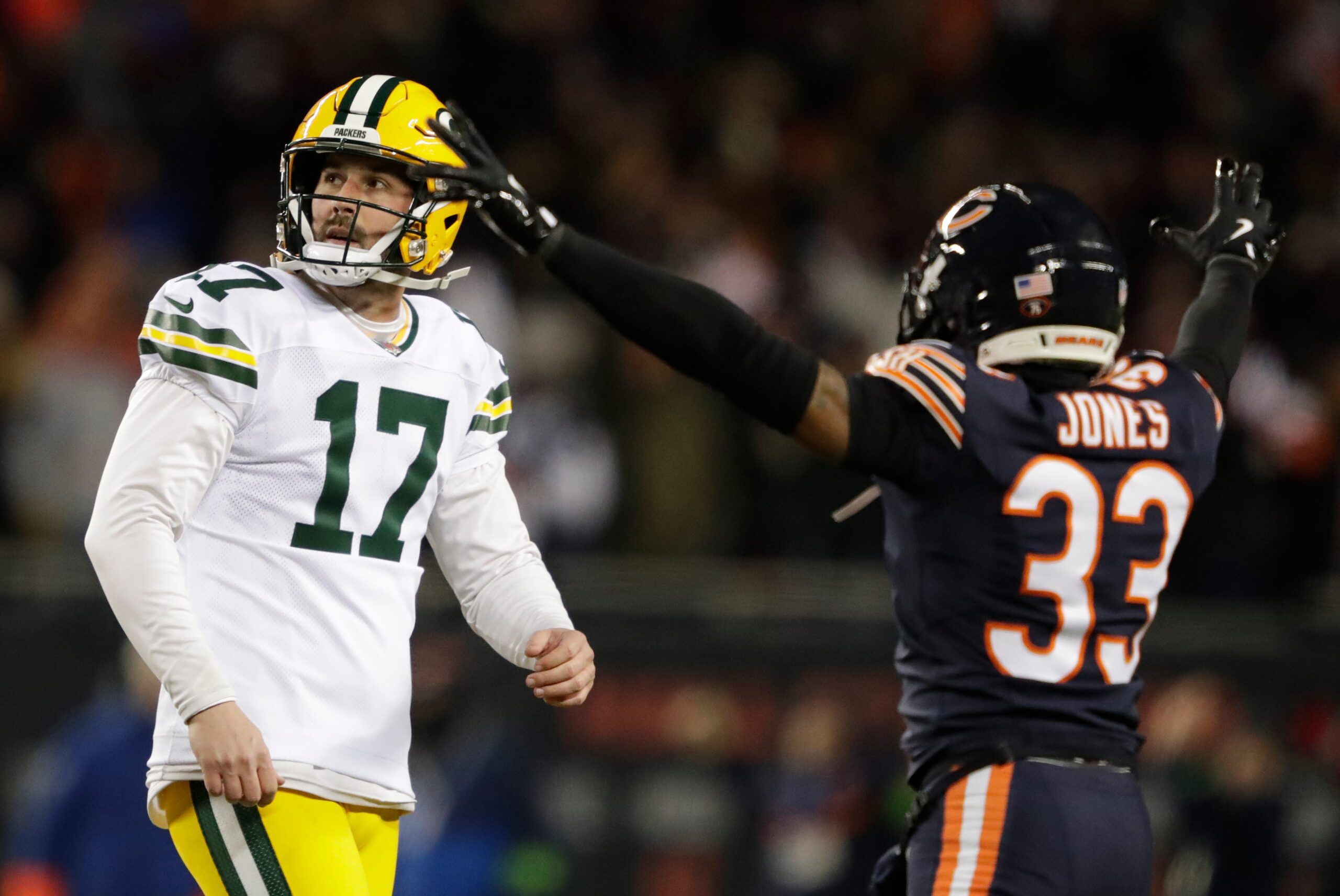 Green Bay Packers place kicker Brandon McManus (17) reacts to missing a field goal late in the fourth quarter as Chicago Bears cornerback Jaylon Jones (33) celebrates during their wild-card playoff football game Saturday, January 10, 2026, at Soldier Field in Chicago, Illinois.