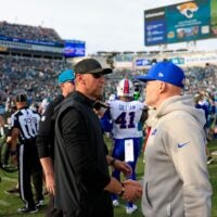 Jacksonville Jaguars head coach Liam Coen, left, greets Buffalo Bills head coach Sean McDermott after the game of an NFL football AFC Wild Card playoff matchup, Sunday, Jan. 11, 2026, in Jacksonville, Fla. The Bills defeated the Jaguars 27-24.