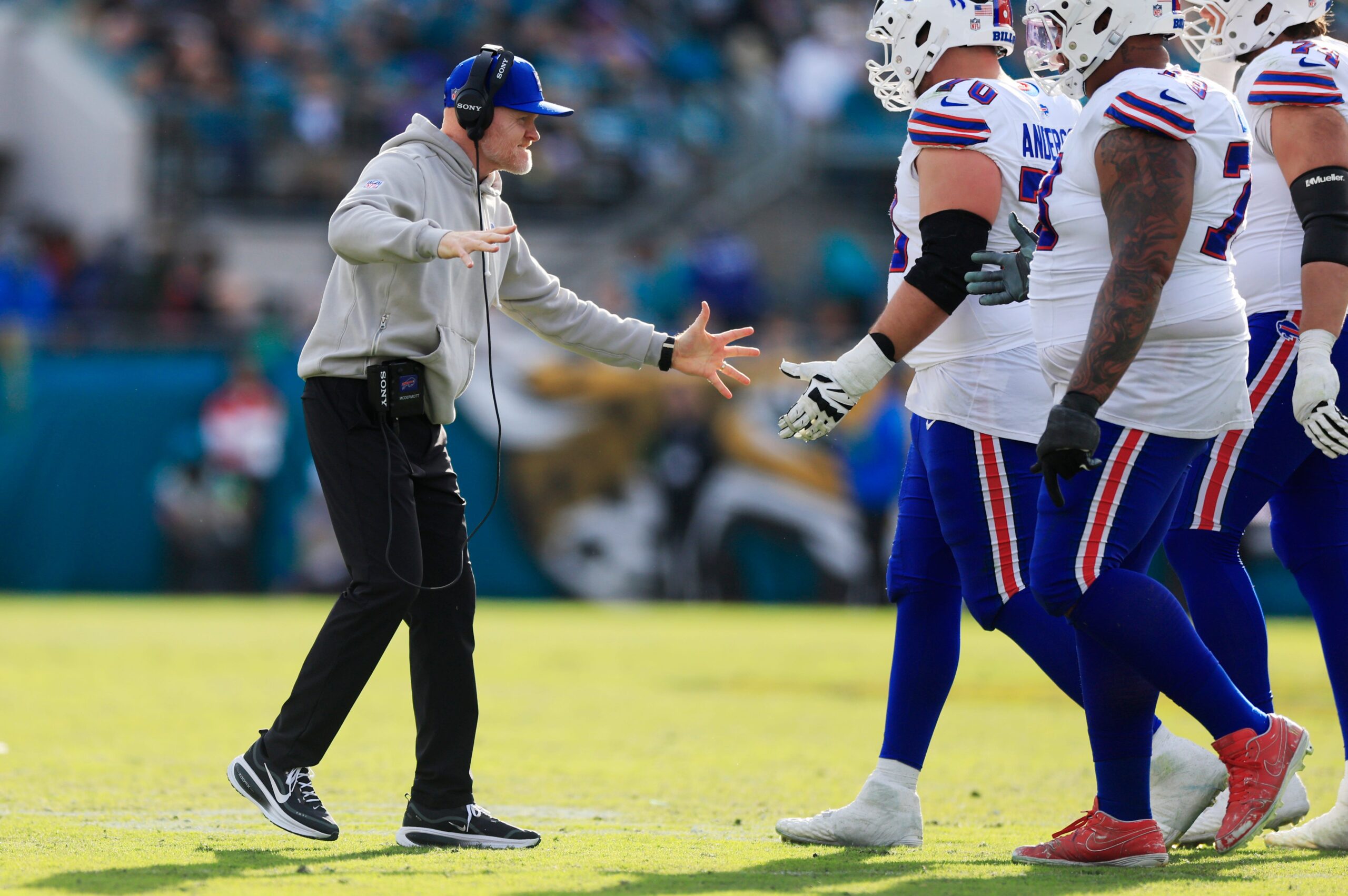 Buffalo Bills head coach Sean McDermott high-fives teammates during the fourth quarter of an NFL football AFC Wild Card playoff matchup, Sunday, Jan. 11, 2026, in Jacksonville, Fla. The Bills defeated the Jaguars 27-24.