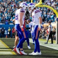 Buffalo Bills quarterback Josh Allen (17), right, celebrates his touchdown with teammate tight end Dawson Knox (88) during the fourth quarter of an NFL football AFC Wild Card playoff matchup, Sunday, Jan. 11, 2026, in Jacksonville, Fla. The Bills defeated the Jaguars 27-24.