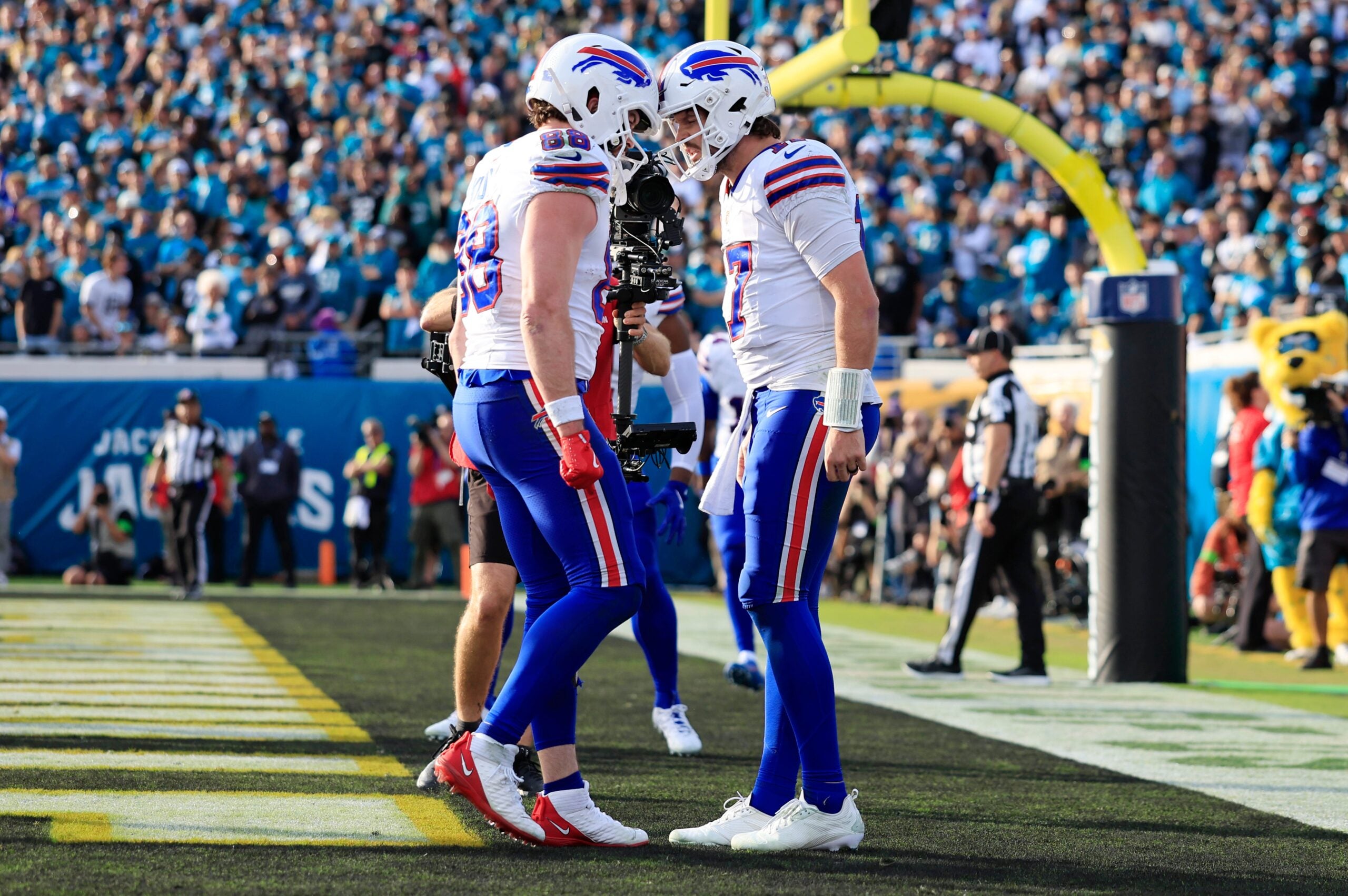 Buffalo Bills quarterback Josh Allen (17), right, celebrates his touchdown with teammate tight end Dawson Knox (88) during the fourth quarter of an NFL football AFC Wild Card playoff matchup, Sunday, Jan. 11, 2026, in Jacksonville, Fla. The Bills defeated the Jaguars 27-24.